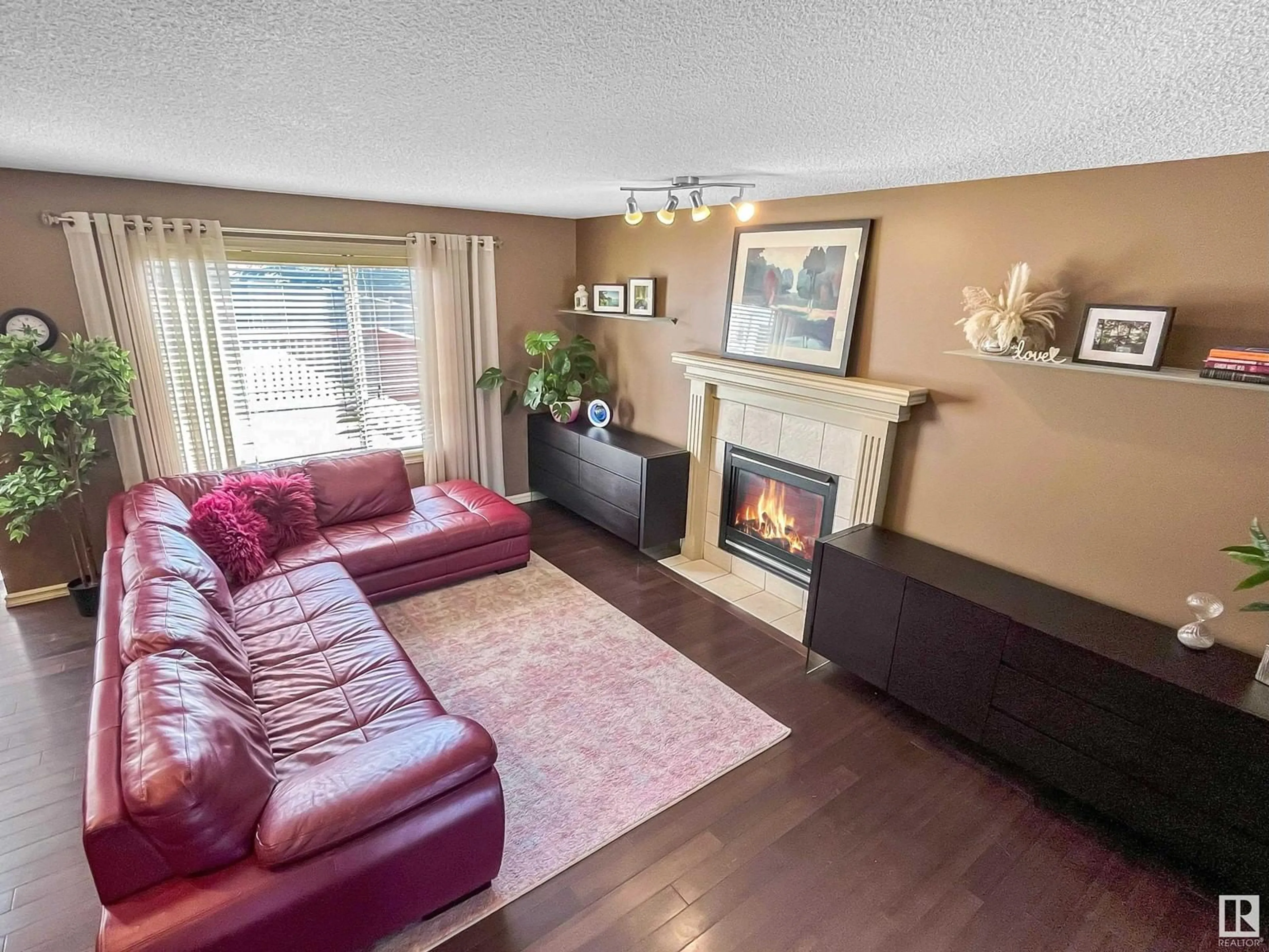 Living room with furniture, wood/laminate floor for 8 EVERWOOD CL, St. Albert Alberta T8N7H1