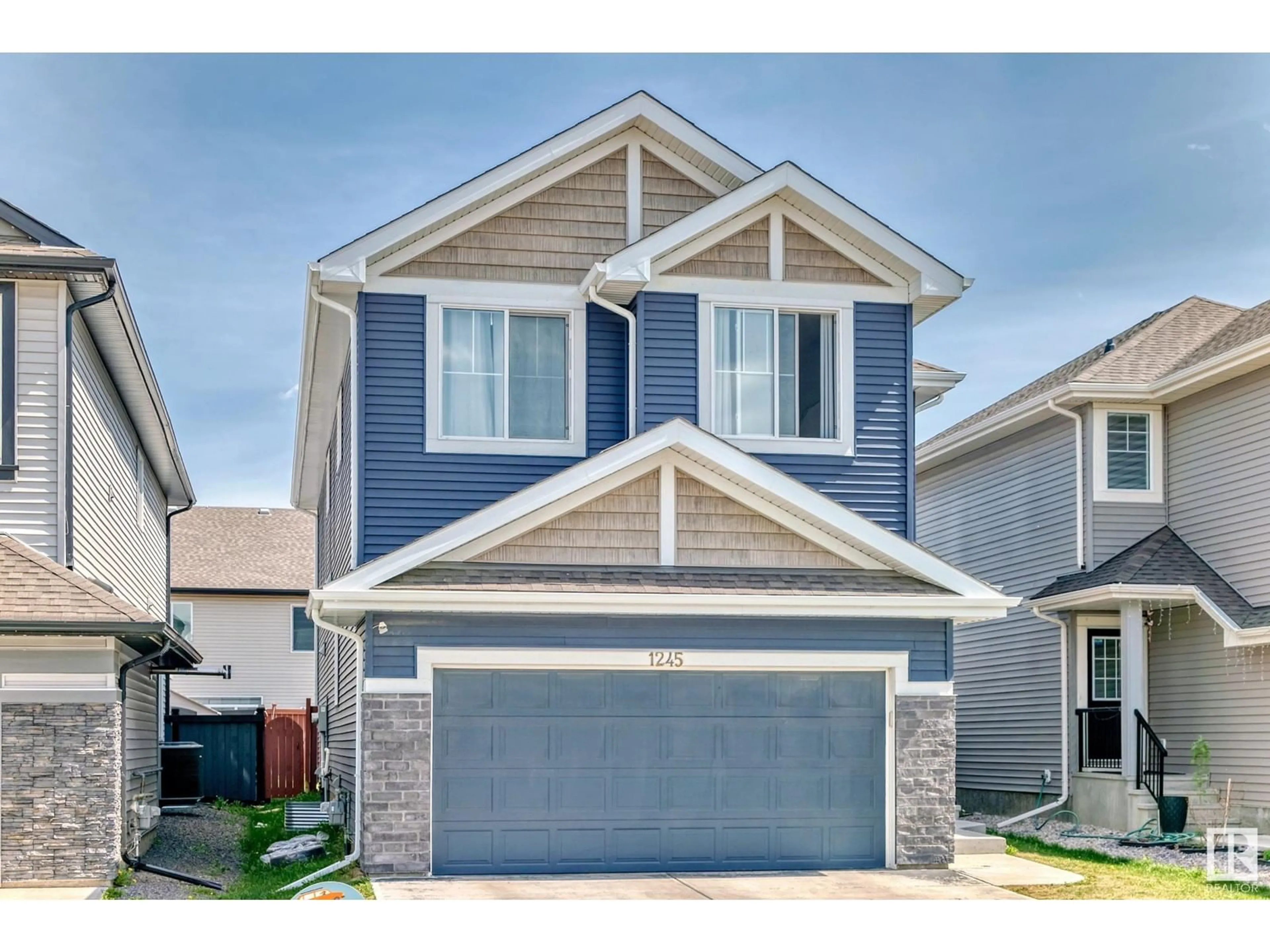Home with vinyl exterior material, street for 1245 26A ST, Edmonton Alberta T6T2J4