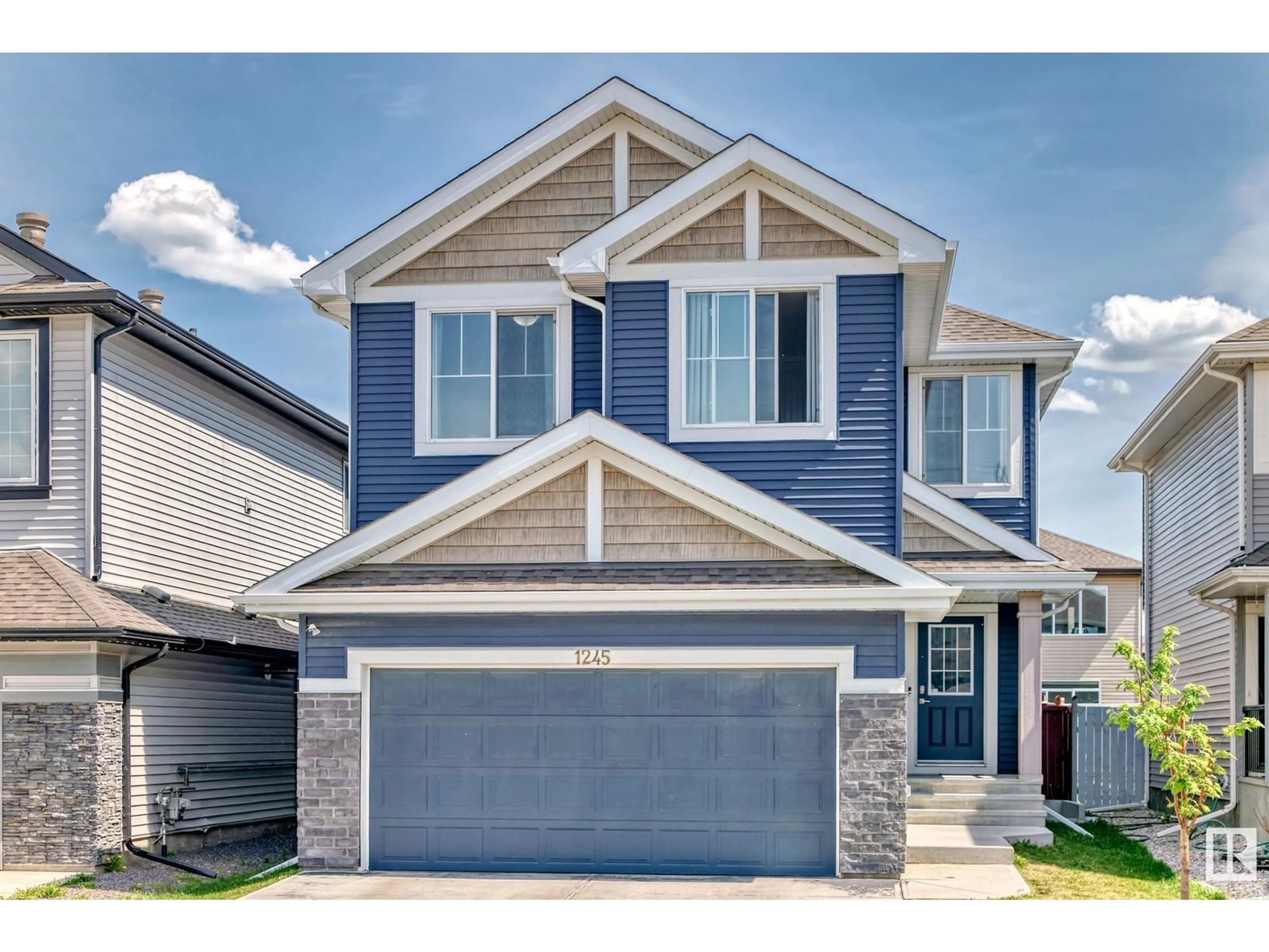 Home with vinyl exterior material, street for 1245 26A ST, Edmonton Alberta T6T2J4