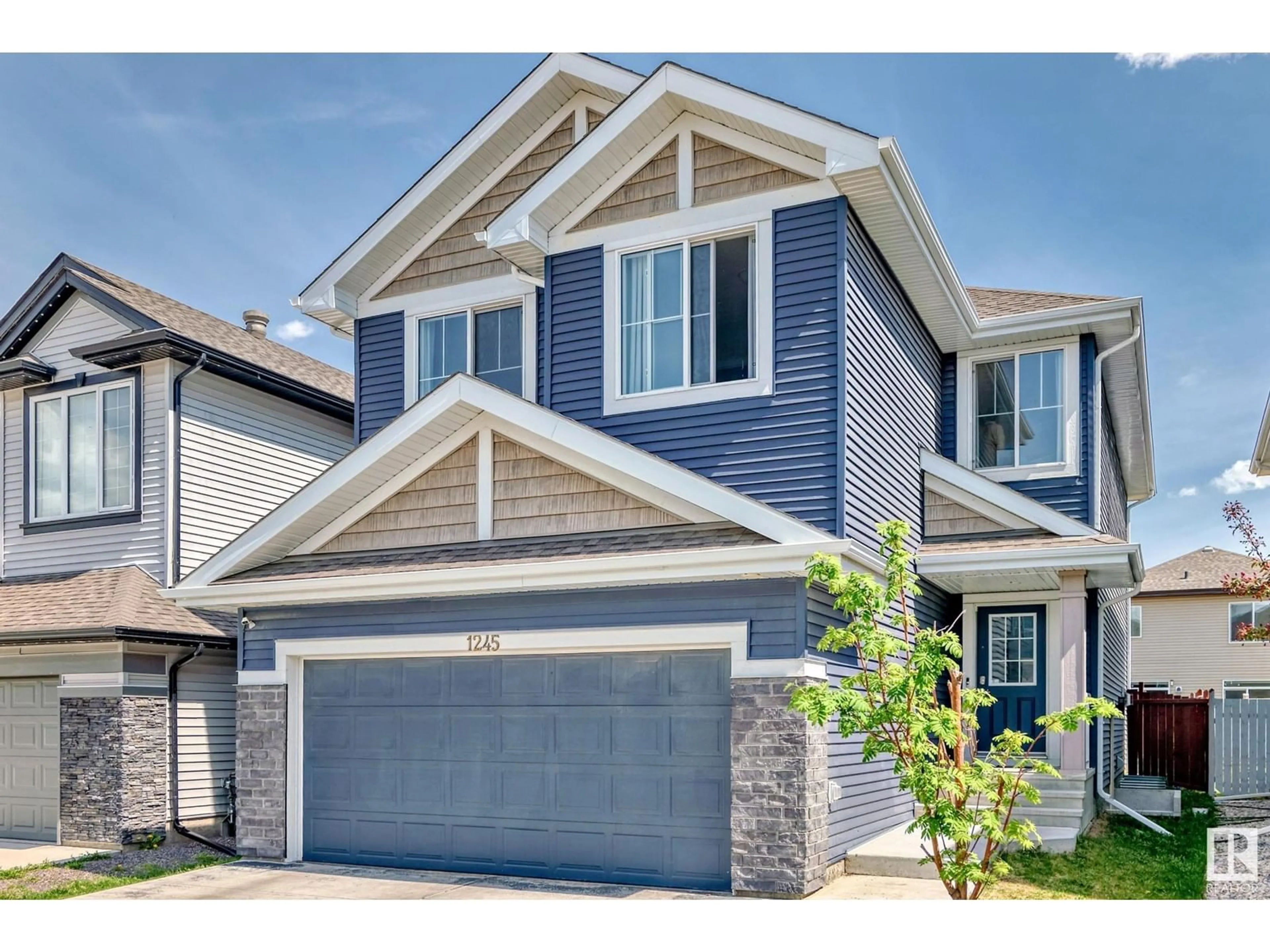 Home with vinyl exterior material, street for 1245 26A ST, Edmonton Alberta T6T2J4