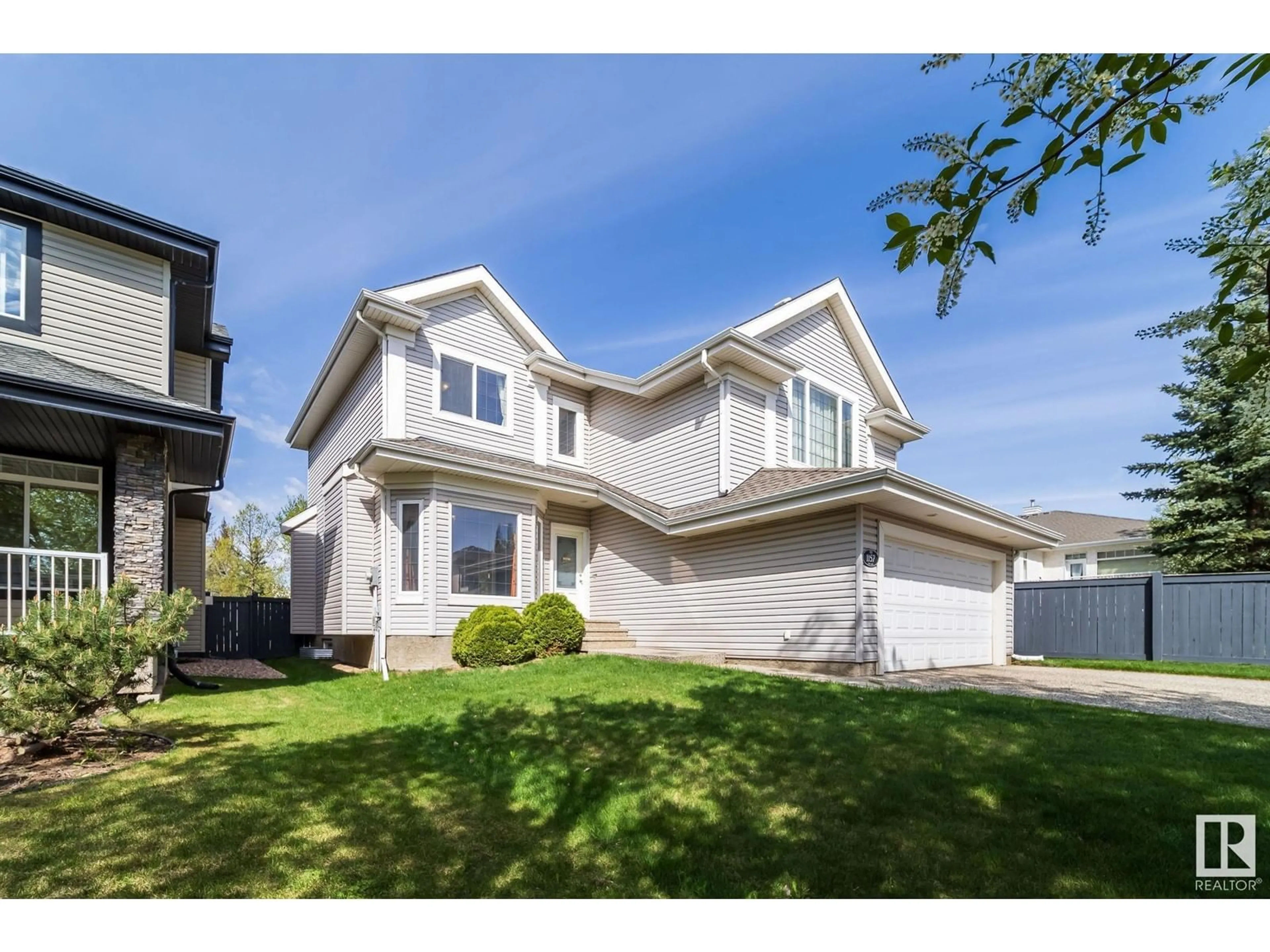 Home with vinyl exterior material, street for 1157 TORY RD, Edmonton Alberta T6R3P2