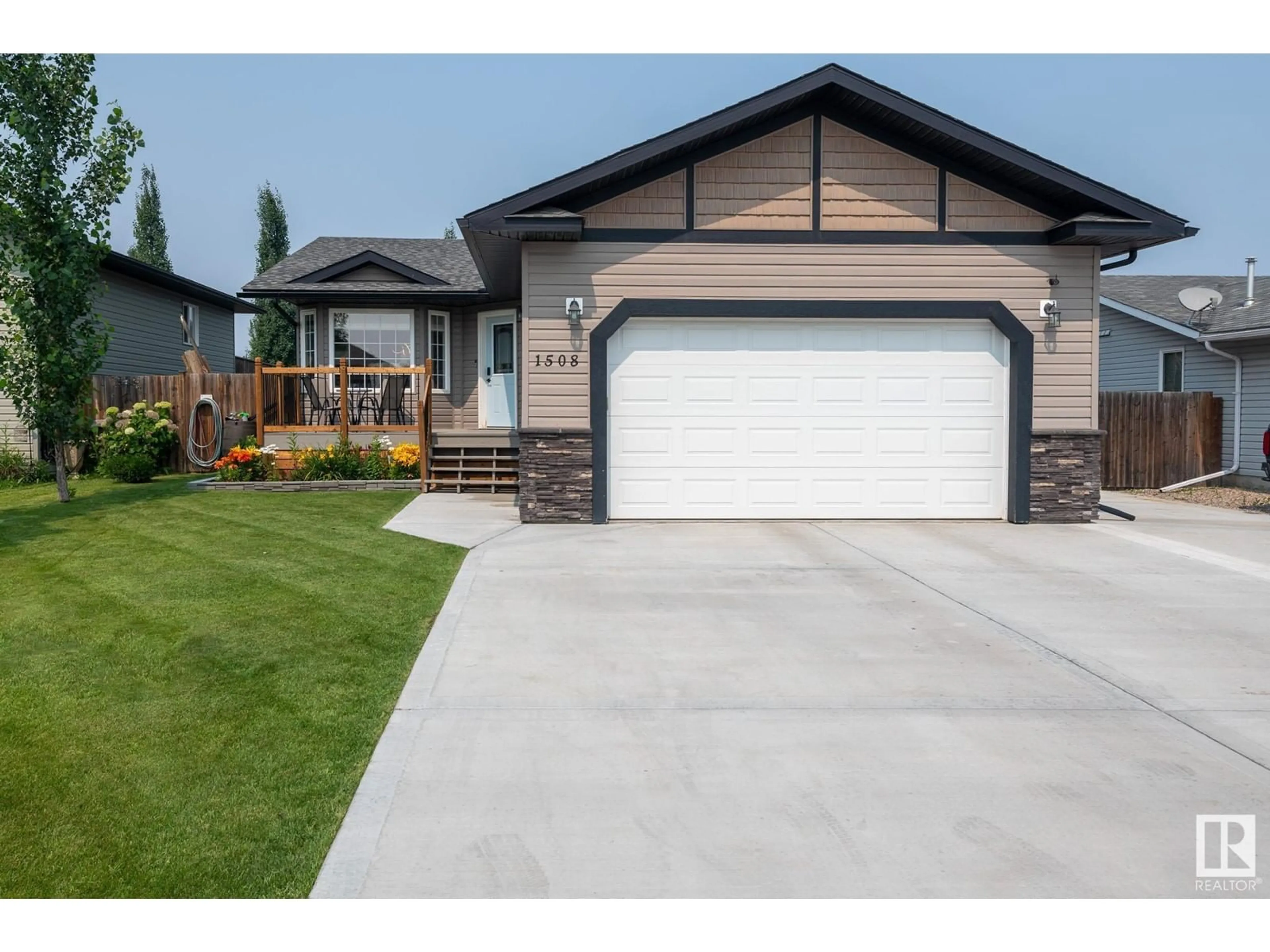 Home with vinyl exterior material, street for 1508 14 AV, Cold Lake Alberta T9M1Z8