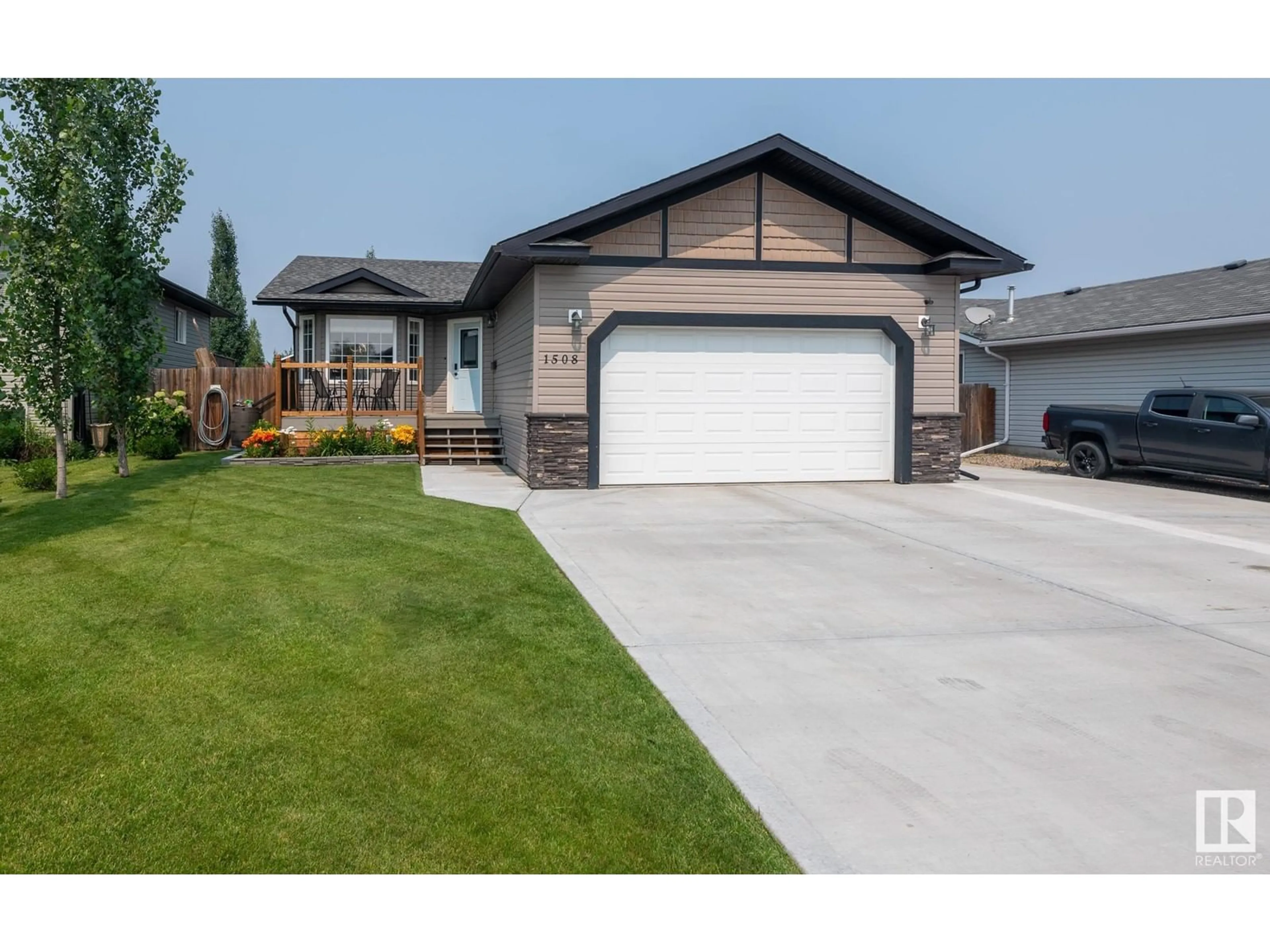 Home with vinyl exterior material, street for 1508 14 AV, Cold Lake Alberta T9M1Z8