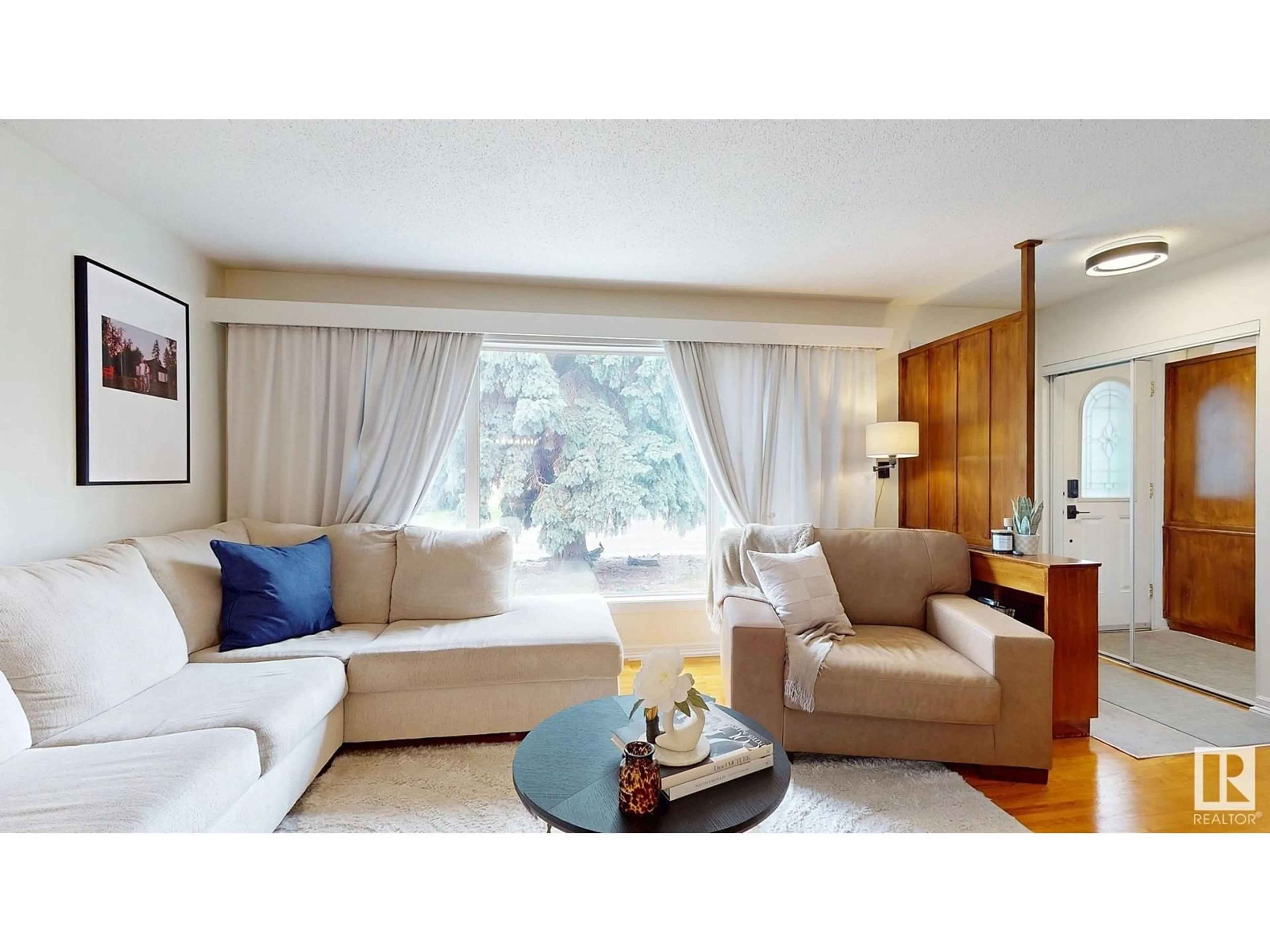 Living room with furniture, wood/laminate floor for NW - 9001 157 ST, Edmonton Alberta T5R2A6