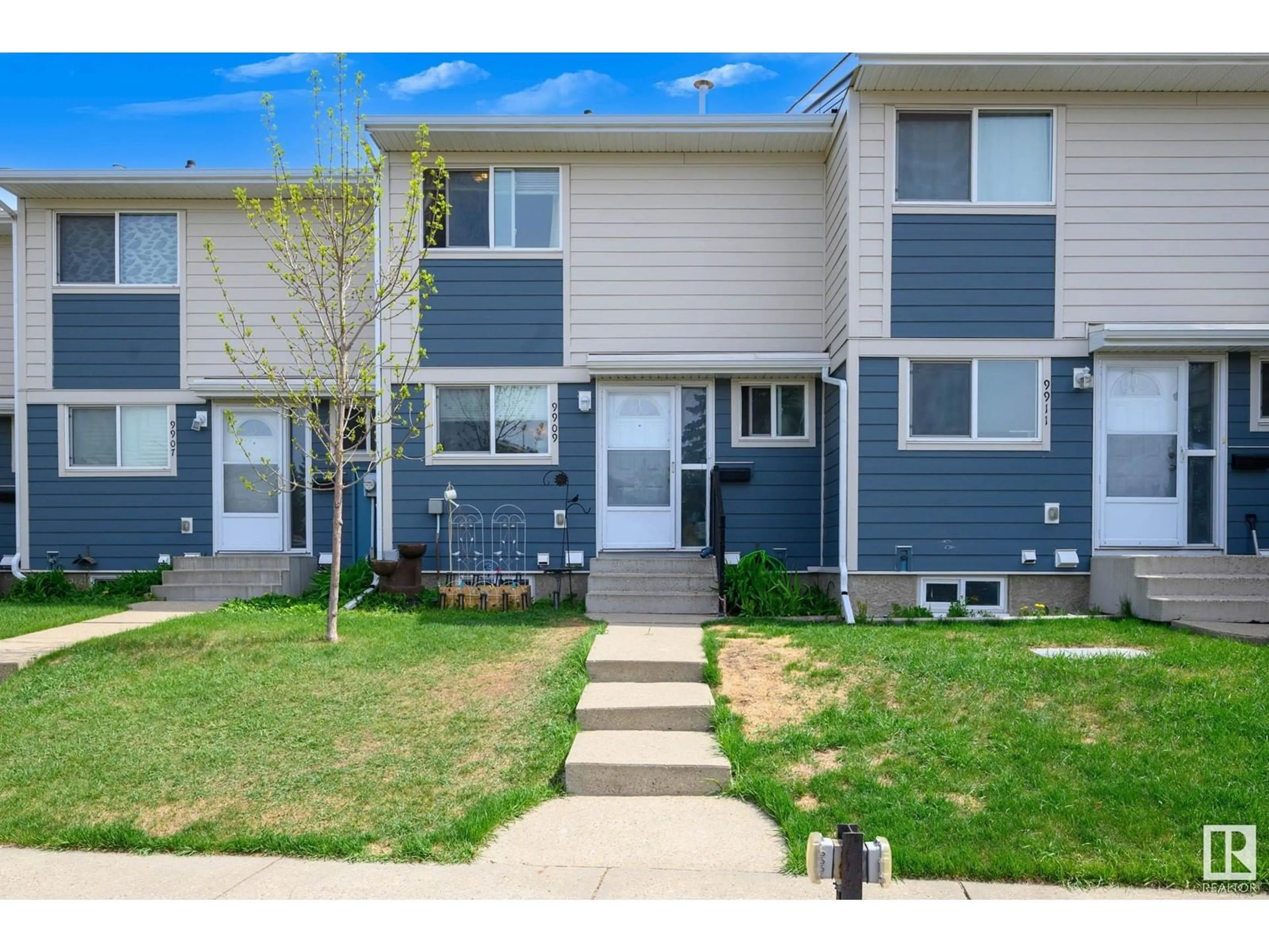 Home with vinyl exterior material, street for 9909 171 AV, Edmonton Alberta T5X4X2