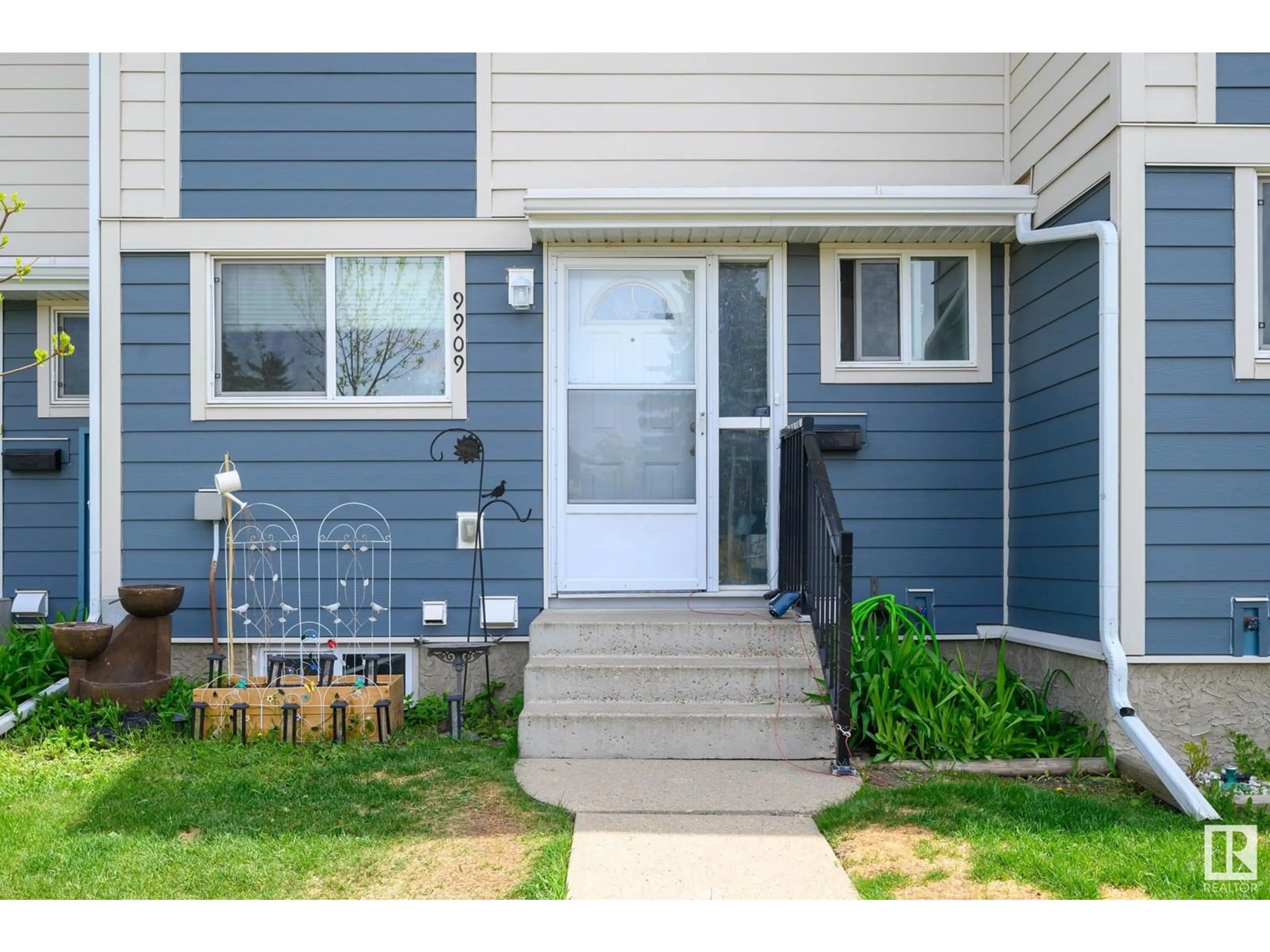 Home with vinyl exterior material, street for 9909 171 AV, Edmonton Alberta T5X4X2