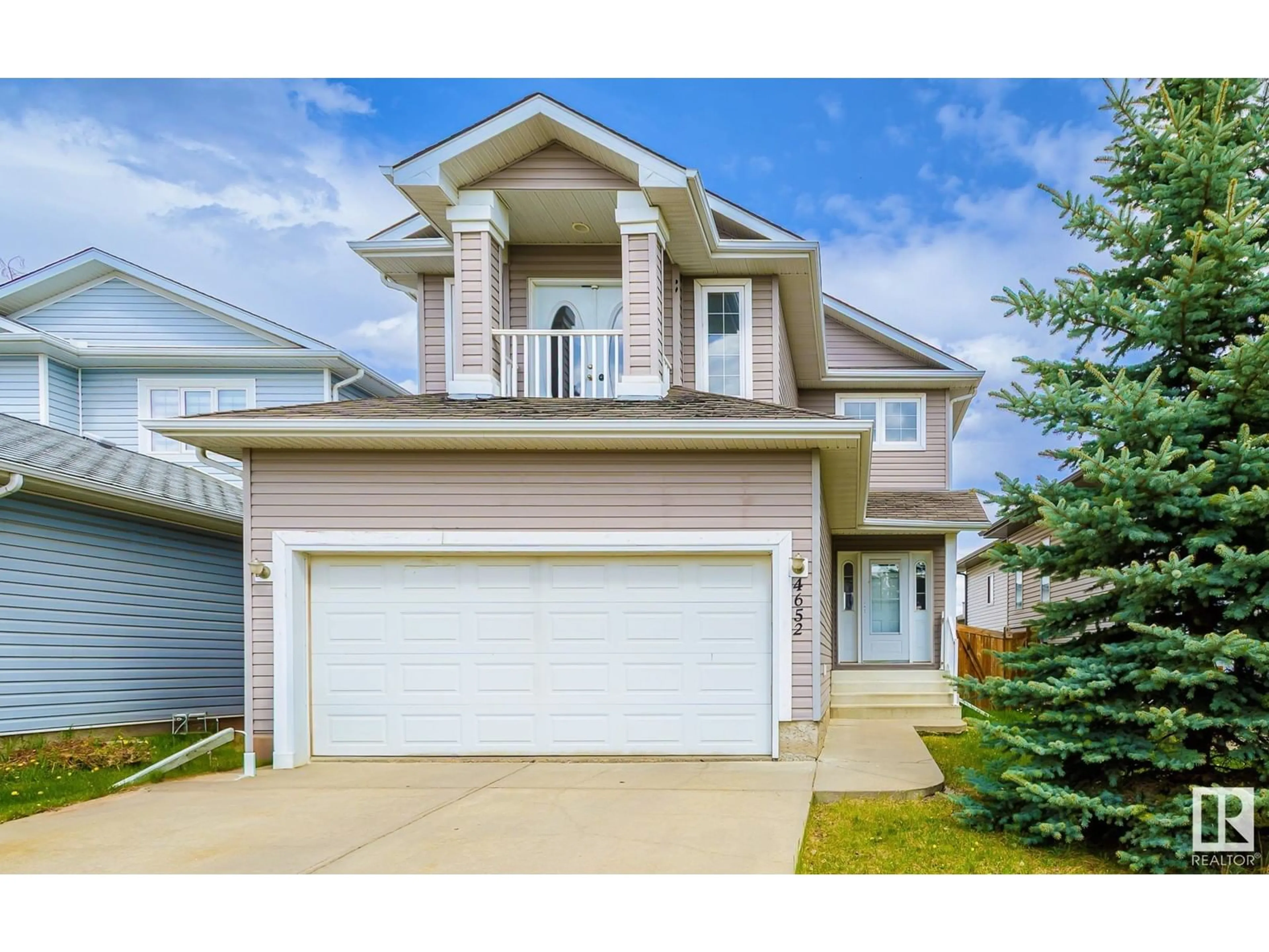 Home with vinyl exterior material, street for 4652 156 AV, Edmonton Alberta T5Y3L9