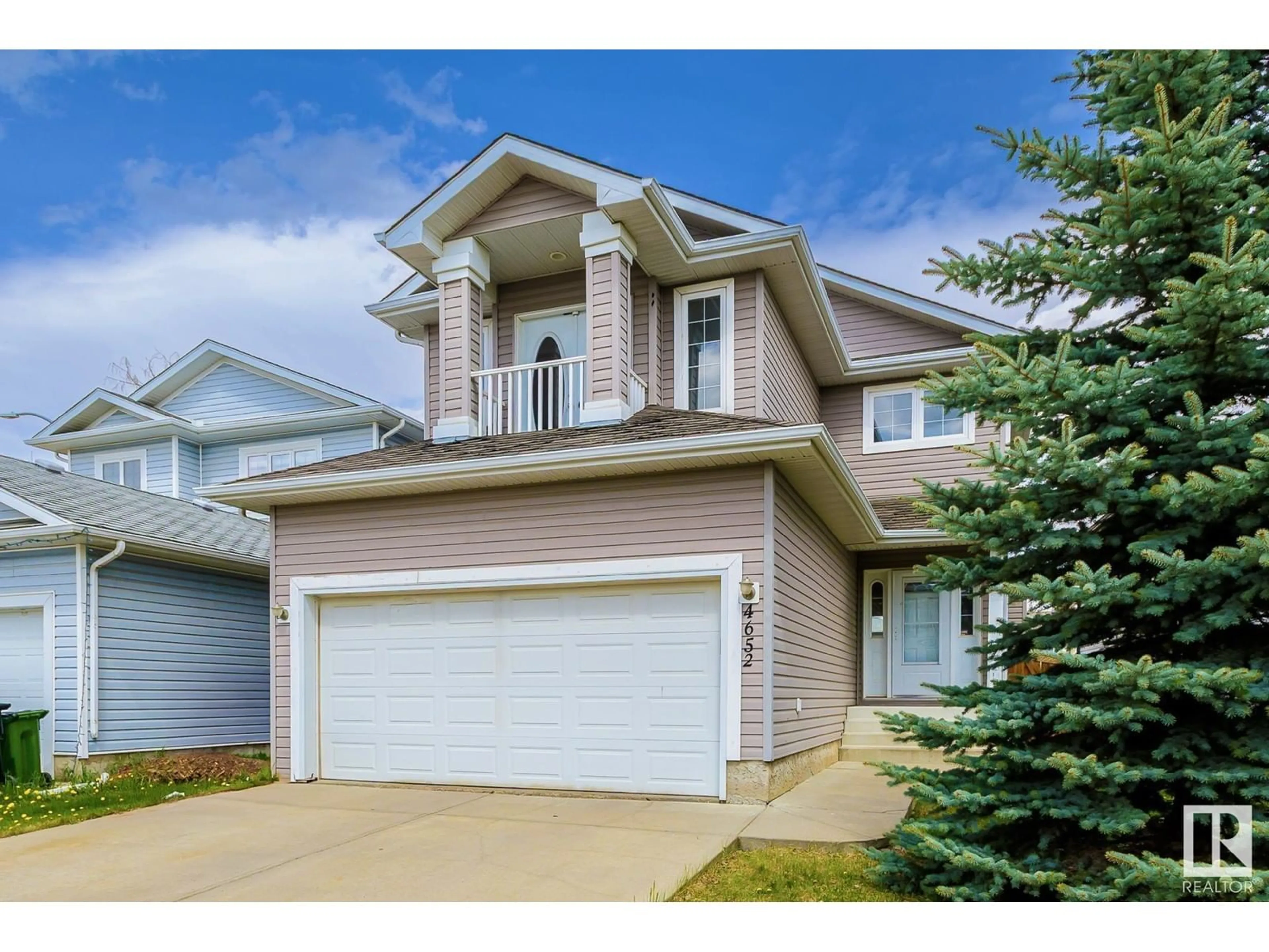 Home with vinyl exterior material, street for 4652 156 AV, Edmonton Alberta T5Y3L9