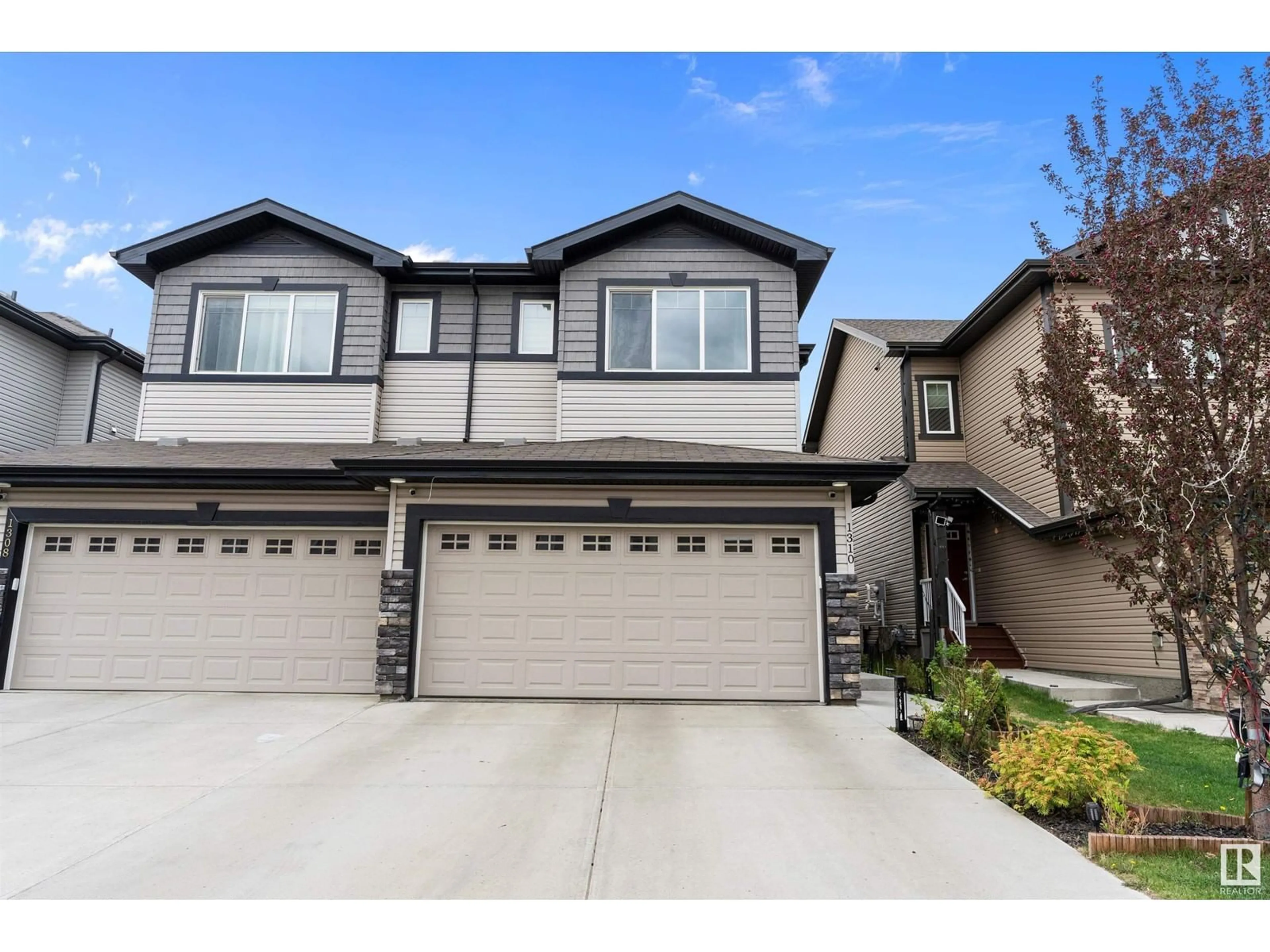 Home with vinyl exterior material, street for 1310 29 ST, Edmonton Alberta T6T1A9