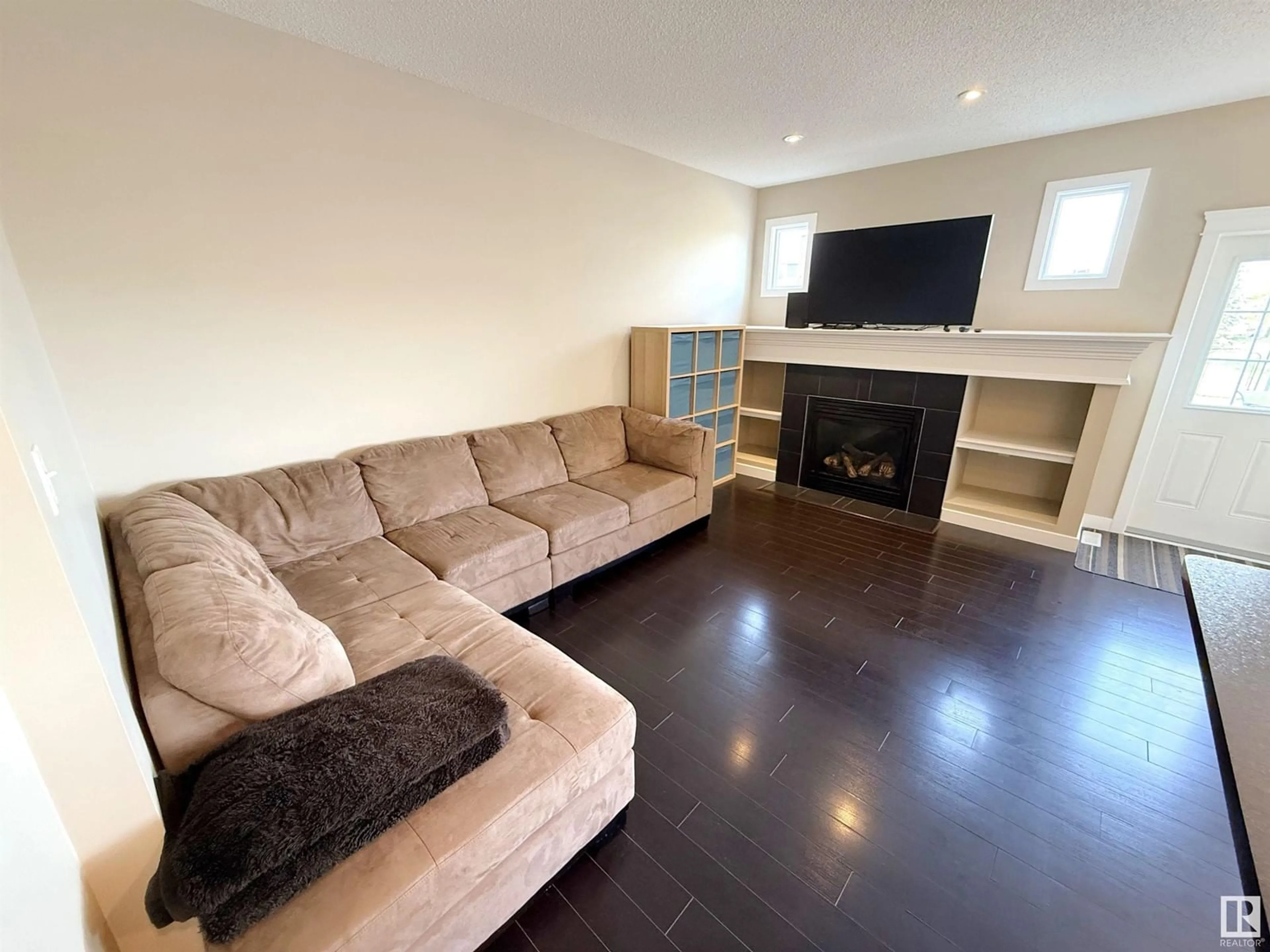 Living room with furniture, wood/laminate floor for 7 MEADOWVIEW CO, Spruce Grove Alberta T7X0N2