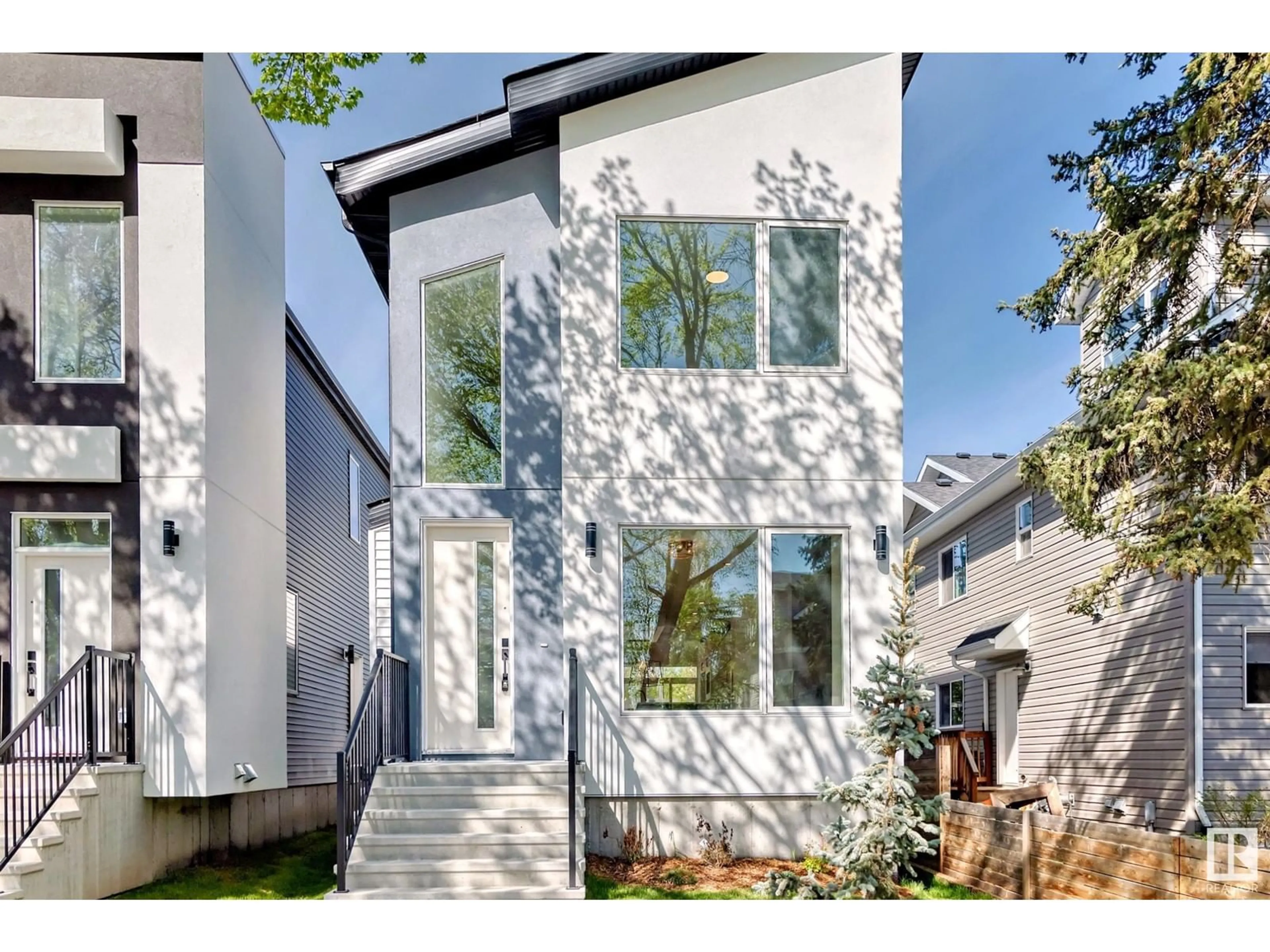 Home with vinyl exterior material, street for 11444 125 ST, Edmonton Alberta T5M0M9