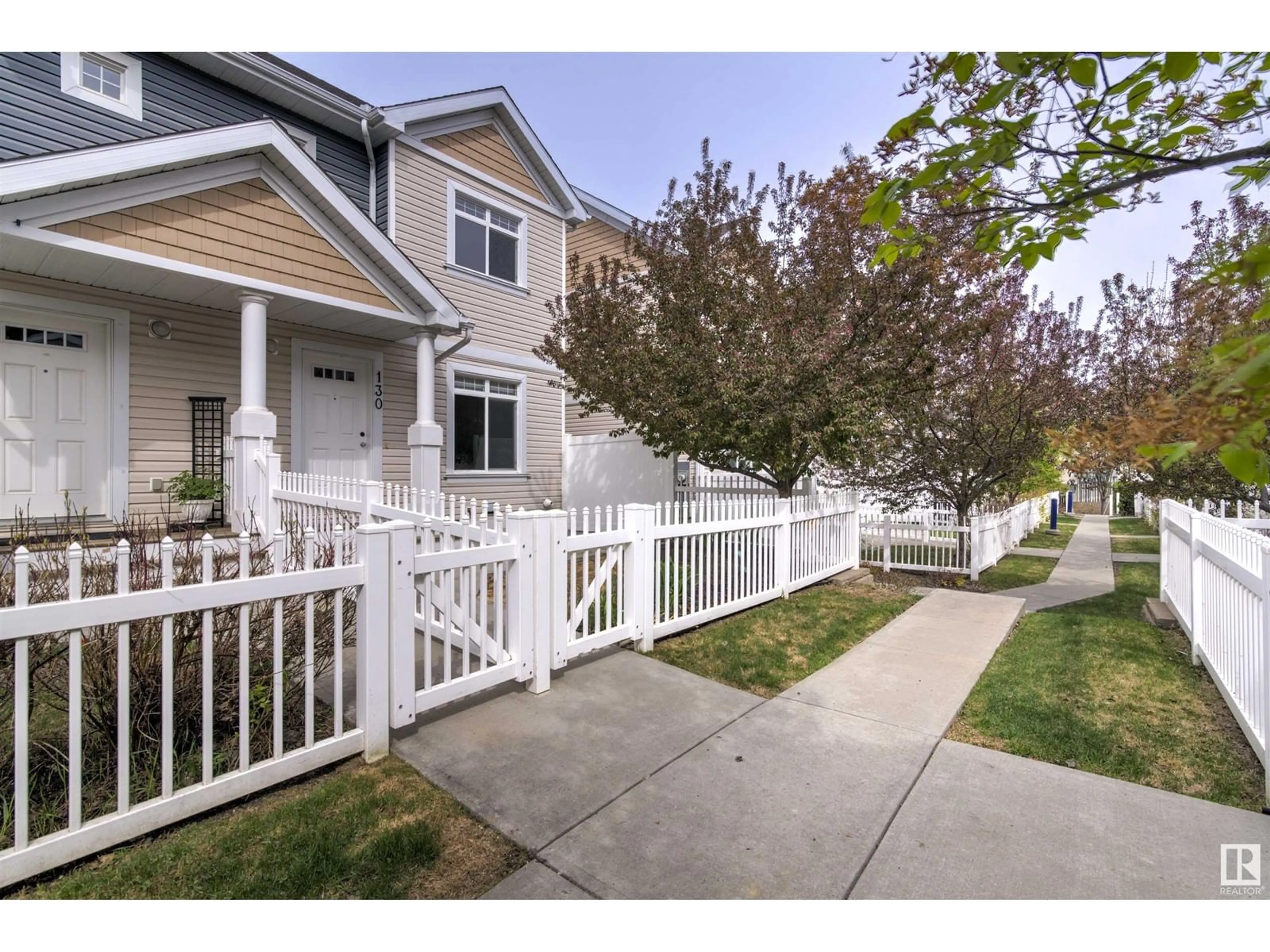 Home with vinyl exterior material, street for #130 - 1804 70 ST, Edmonton Alberta T6X0H4