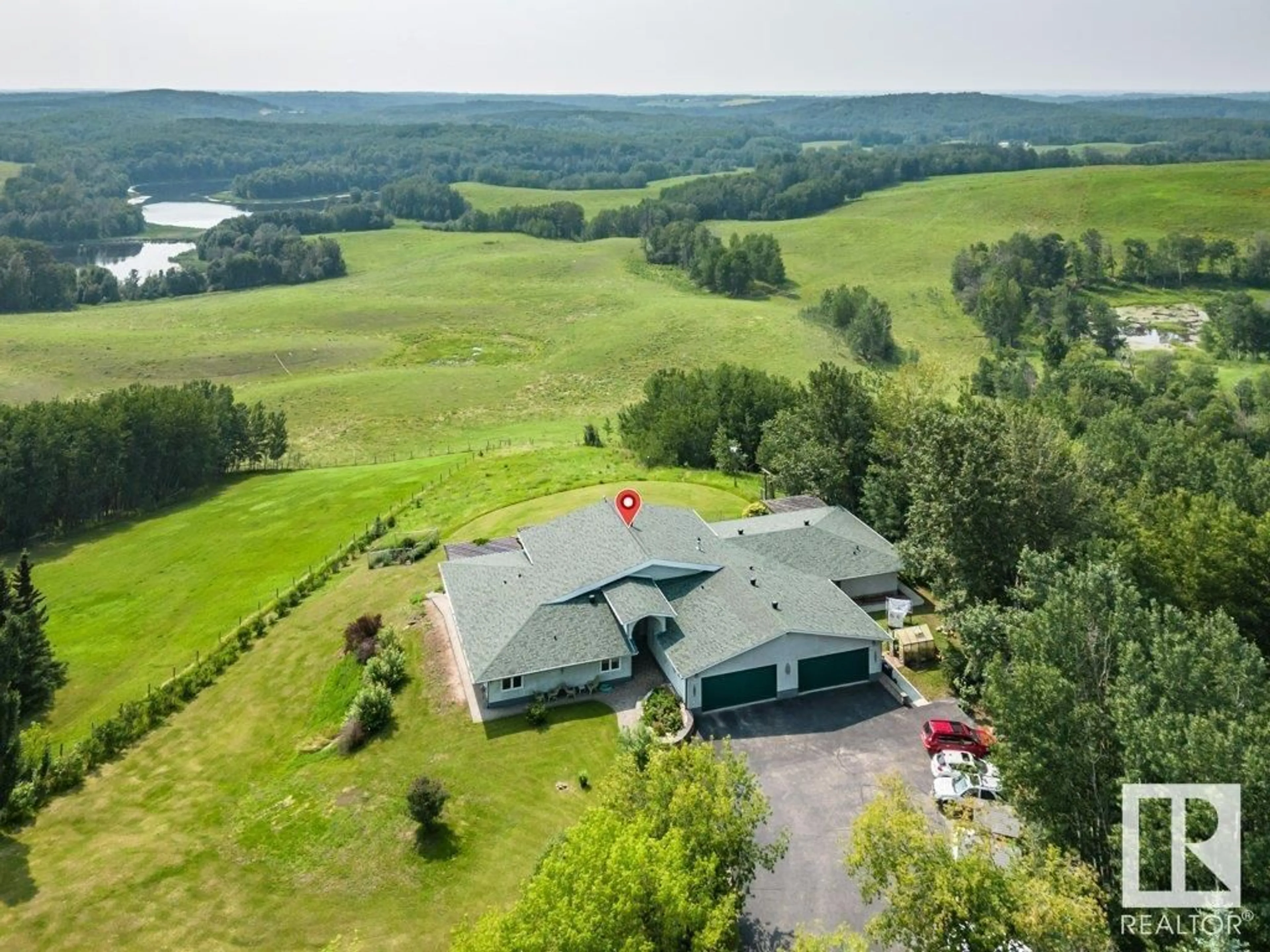 A pic from outside/outdoor area/front of a property/back of a property/a pic from drone, water/lake/river/ocean view for 127 - 1103 TWP RD 540, Rural Parkland County Alberta T7Y0A6