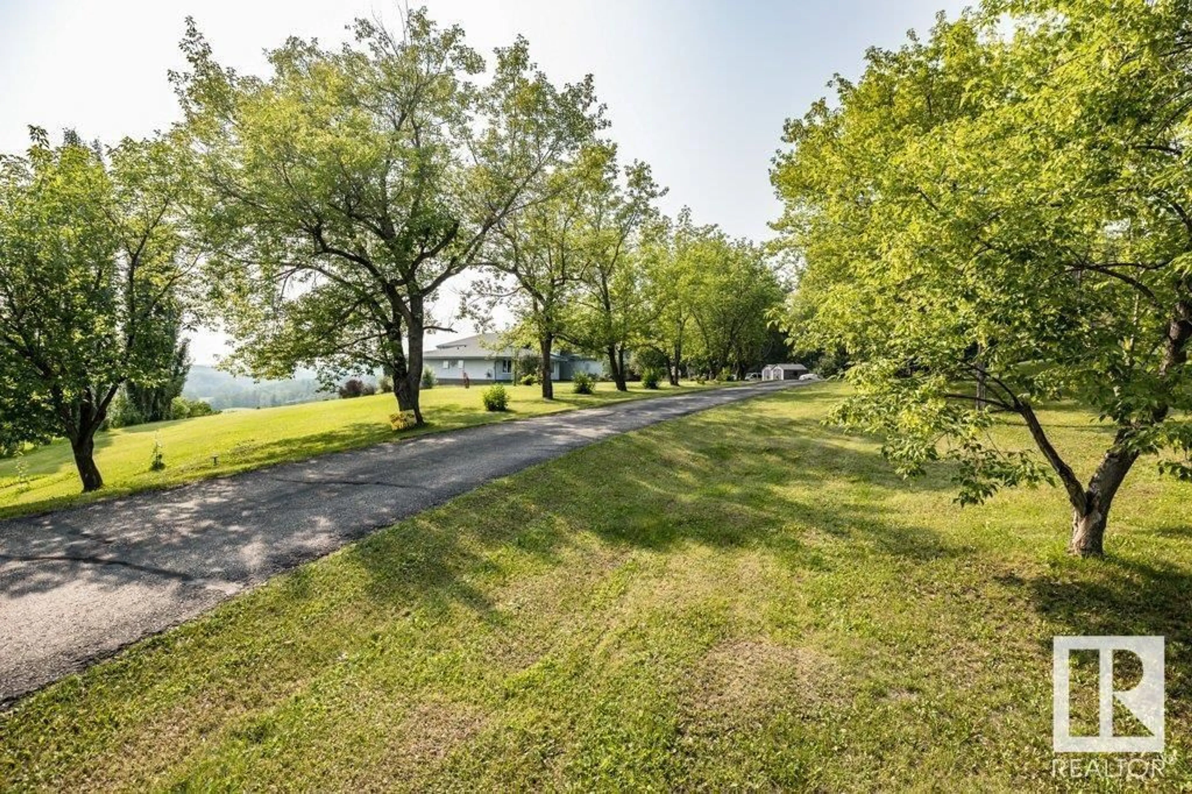 A pic from outside/outdoor area/front of a property/back of a property/a pic from drone, water/lake/river/ocean view for 127 - 1103 TWP RD 540, Rural Parkland County Alberta T7Y0A6