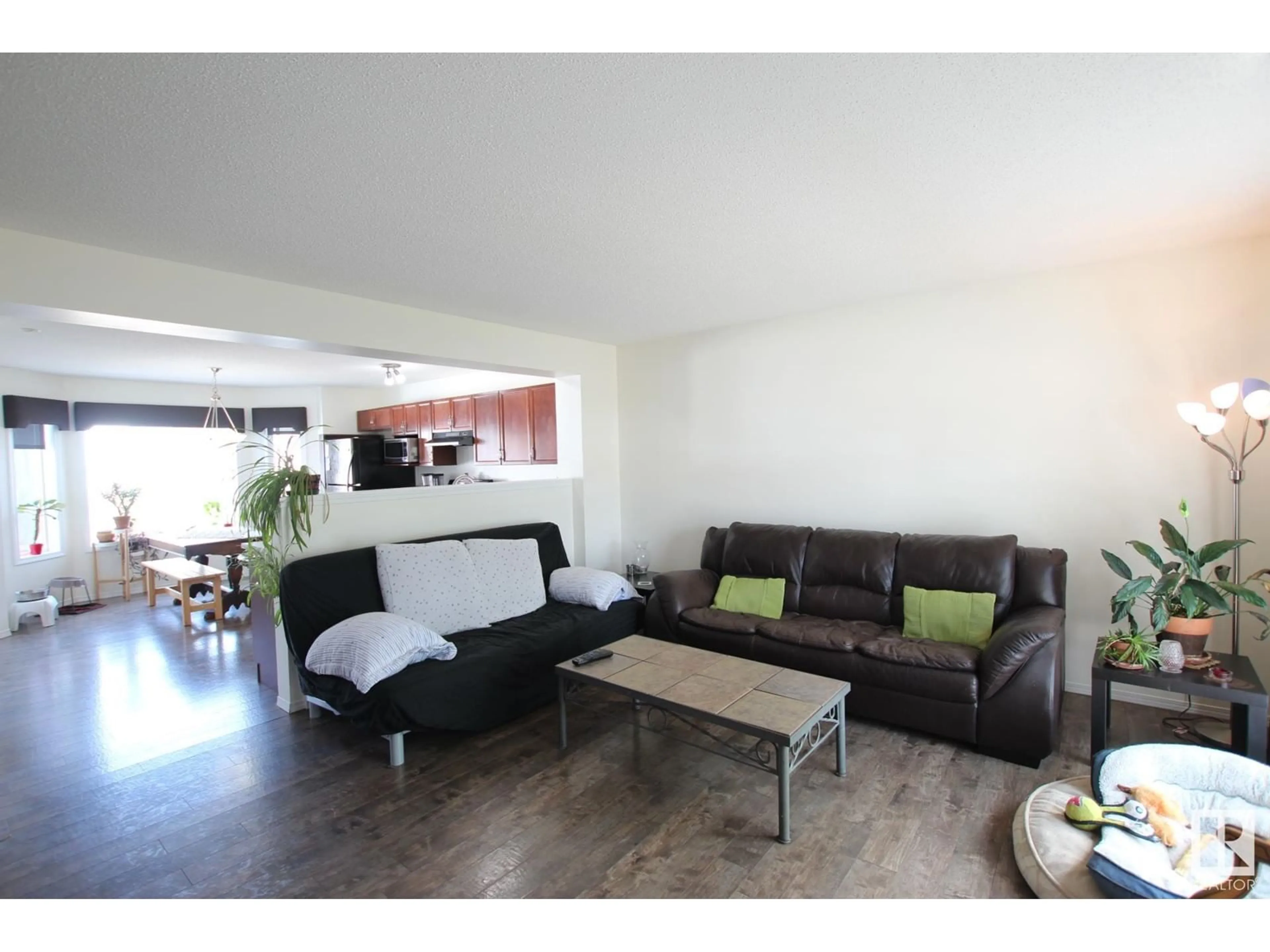 Living room with furniture, wood/laminate floor for 6032 SOUTH TERWILLEGAR BV, Edmonton Alberta T6R0K6