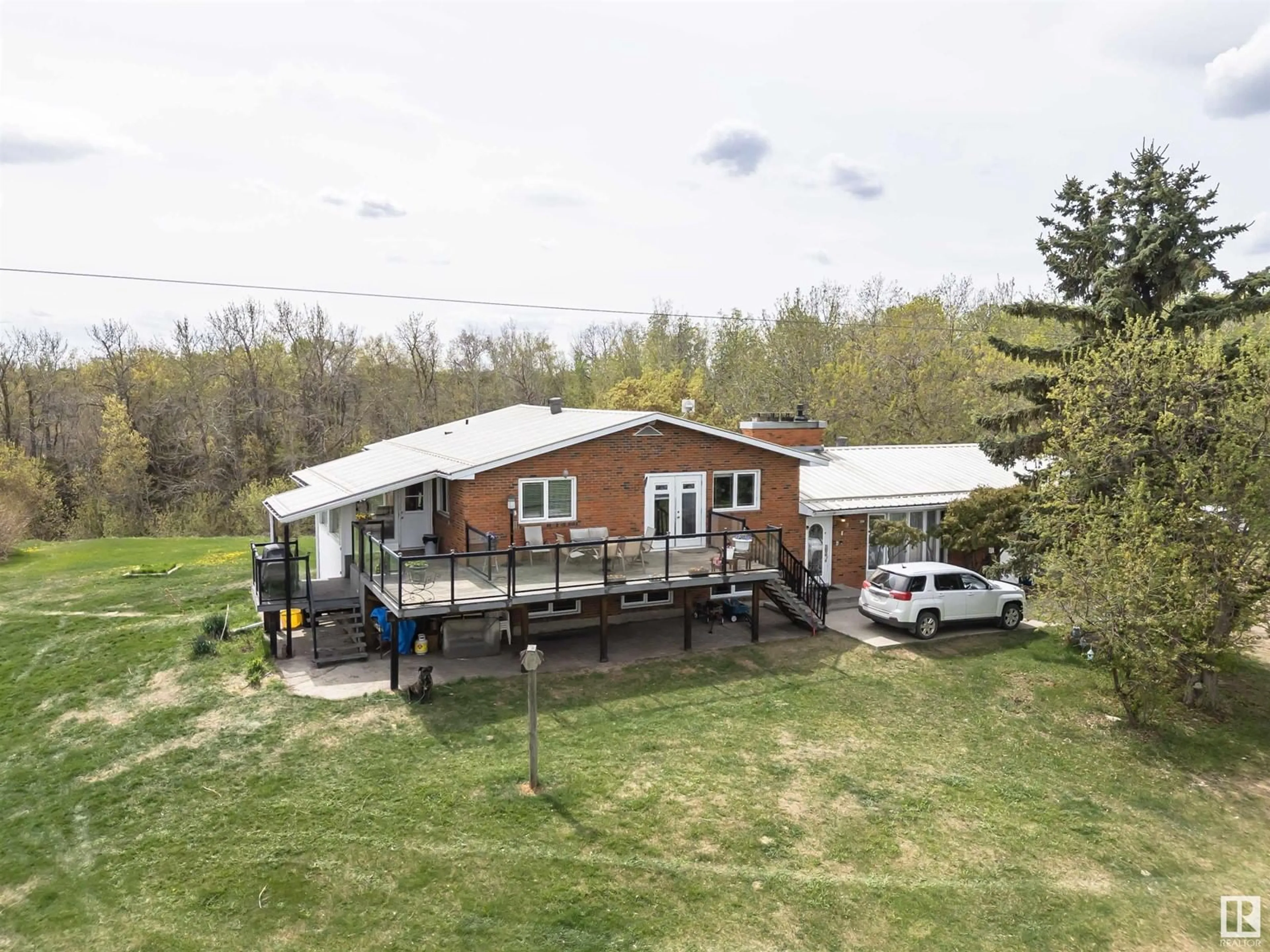 A pic from outside/outdoor area/front of a property/back of a property/a pic from drone, building for 56505 RGE ROAD 233, Rural Sturgeon County Alberta T0A1N0