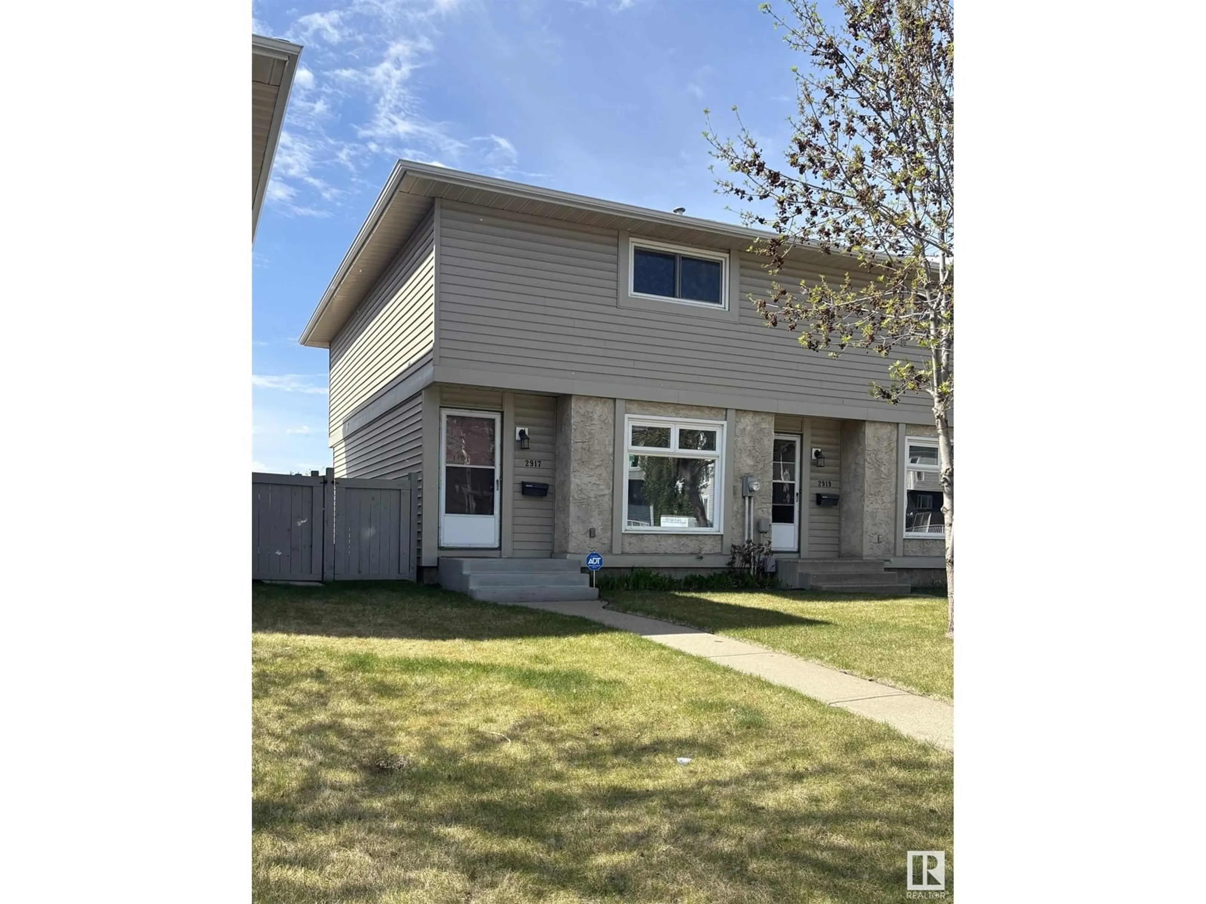 Home with vinyl exterior material, street for NW - 2917 151 AV, Edmonton Alberta T5Y2E3