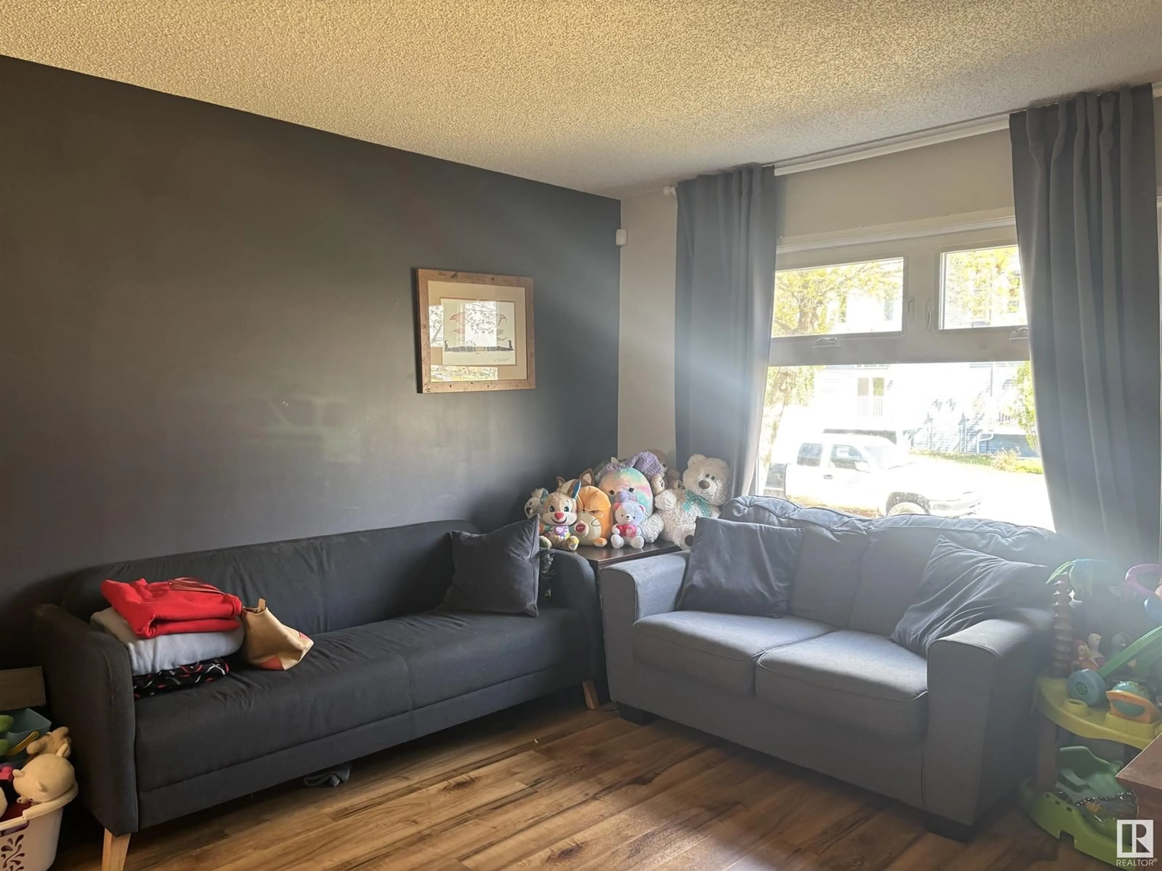 Living room with furniture, unknown for NW - 2917 151 AV, Edmonton Alberta T5Y2E3