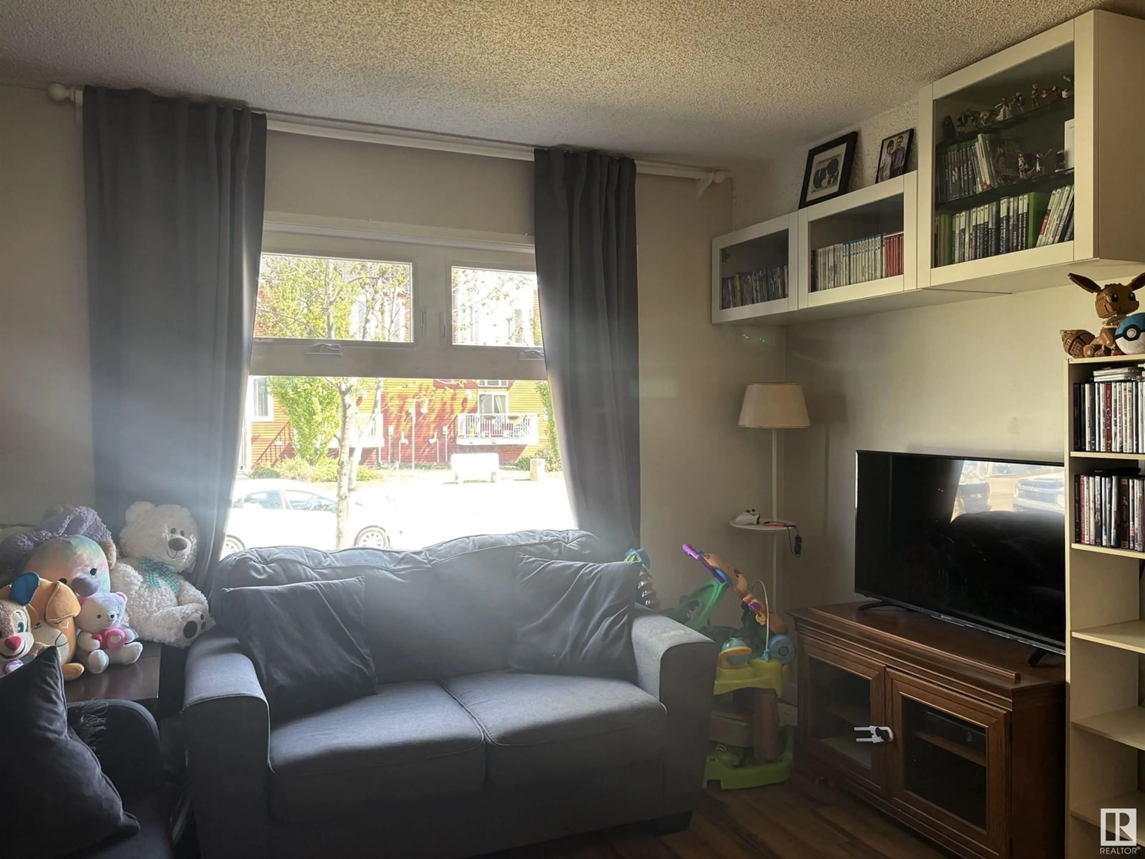 Living room with furniture, unknown for NW - 2917 151 AV, Edmonton Alberta T5Y2E3