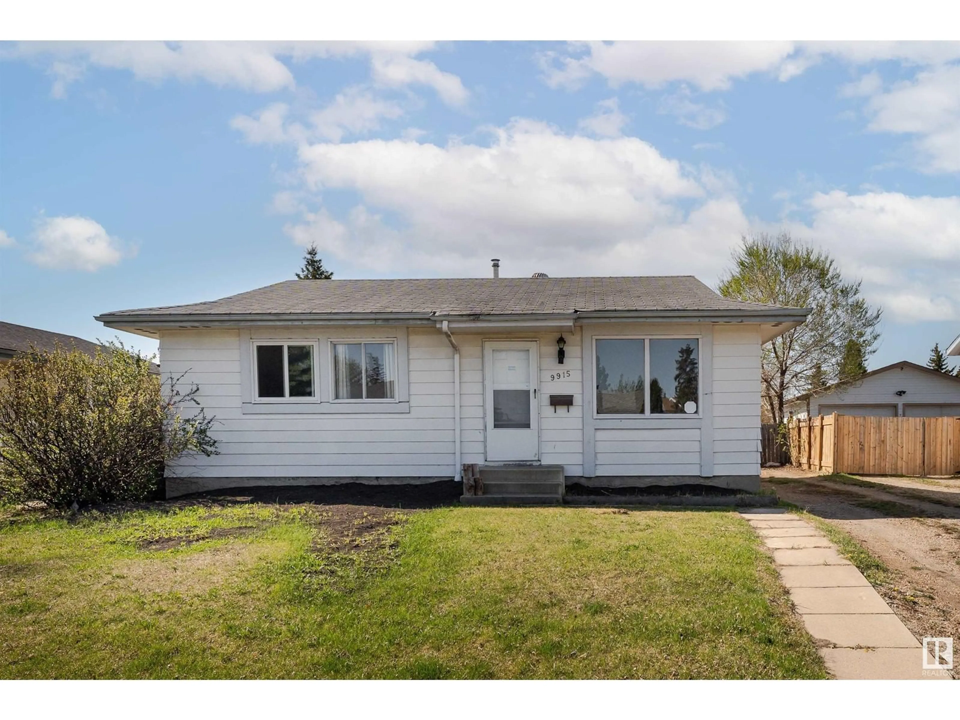 Home with vinyl exterior material, street for 9915 170 AV, Edmonton Alberta T5X3G3