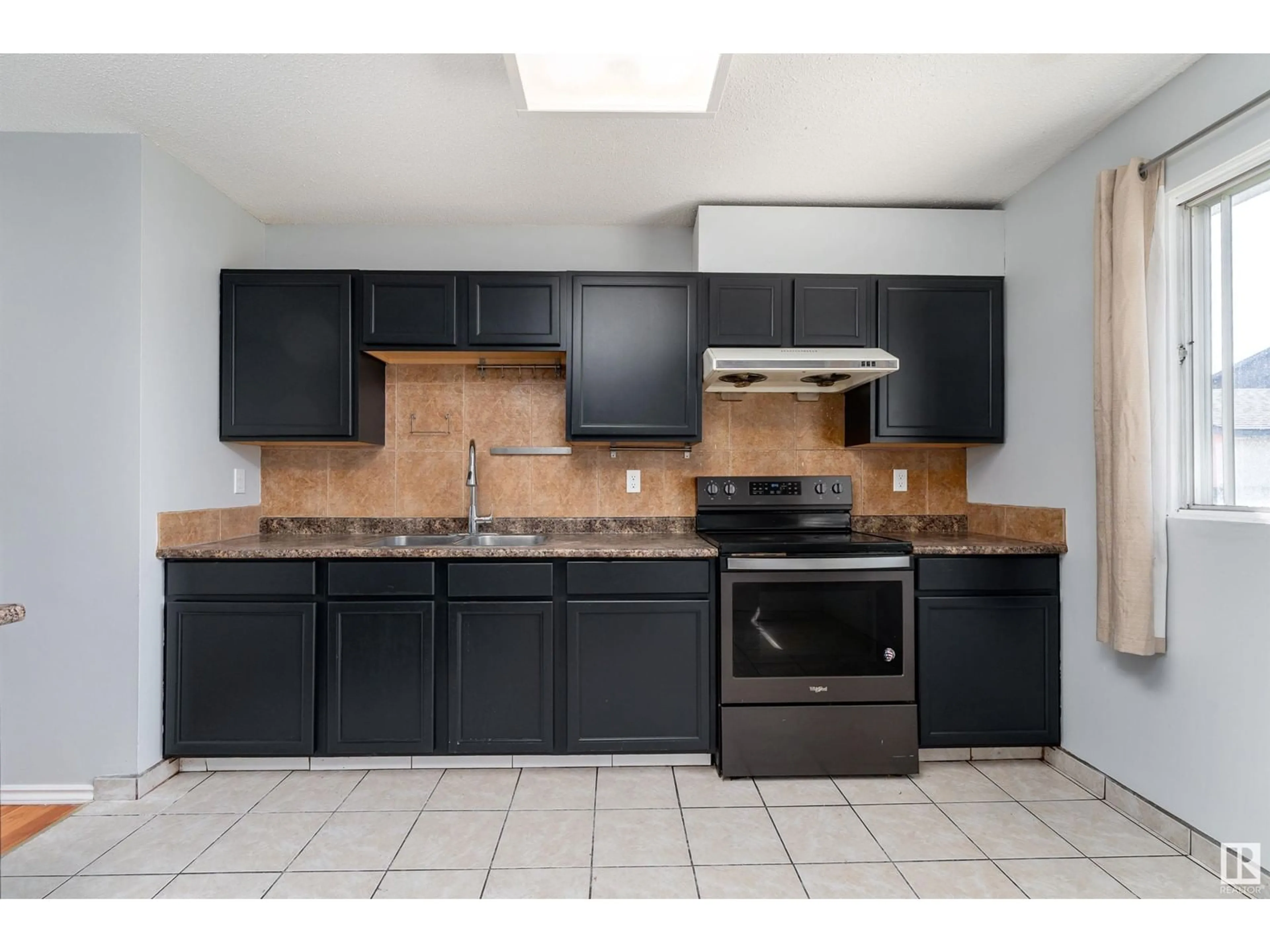 Standard kitchen, ceramic/tile floor for 9915 170 AV, Edmonton Alberta T5X3G3