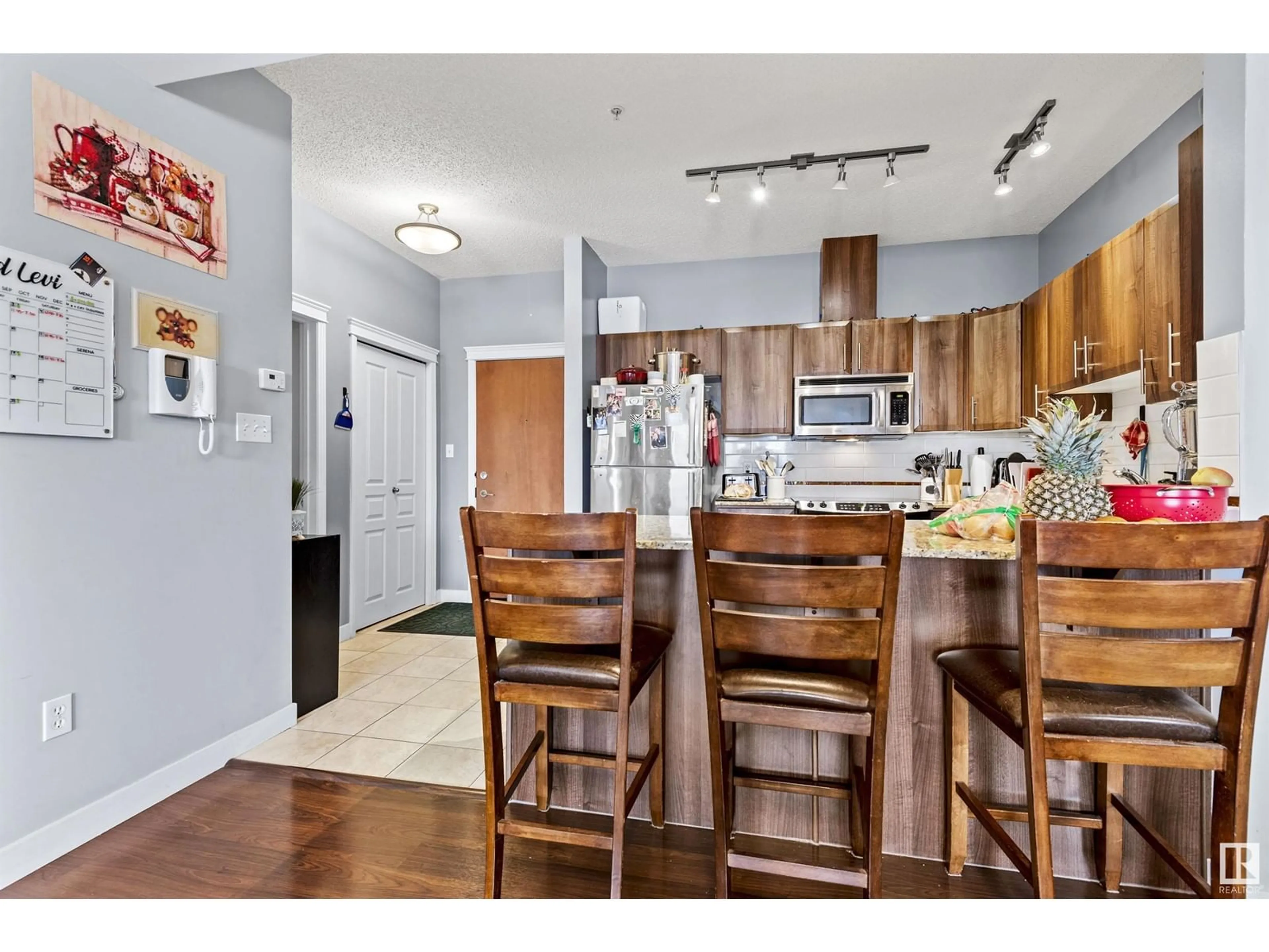 Open concept kitchen, wood/laminate floor for #501 - 10333 112 ST, Edmonton Alberta T5K0B4
