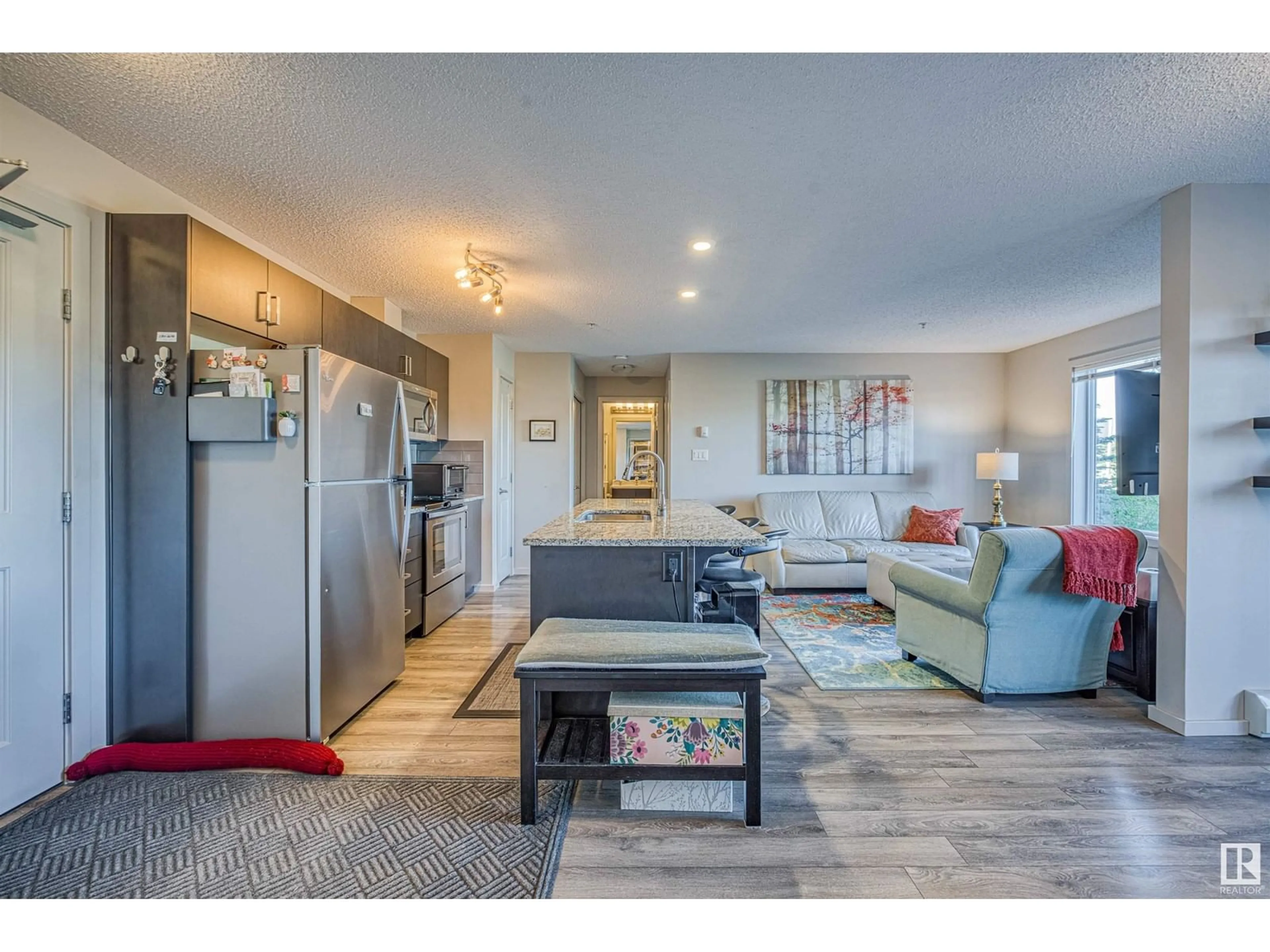 Living room with furniture, unknown for #211 - 211 EBBERS BV, Edmonton Alberta T5Y3W2