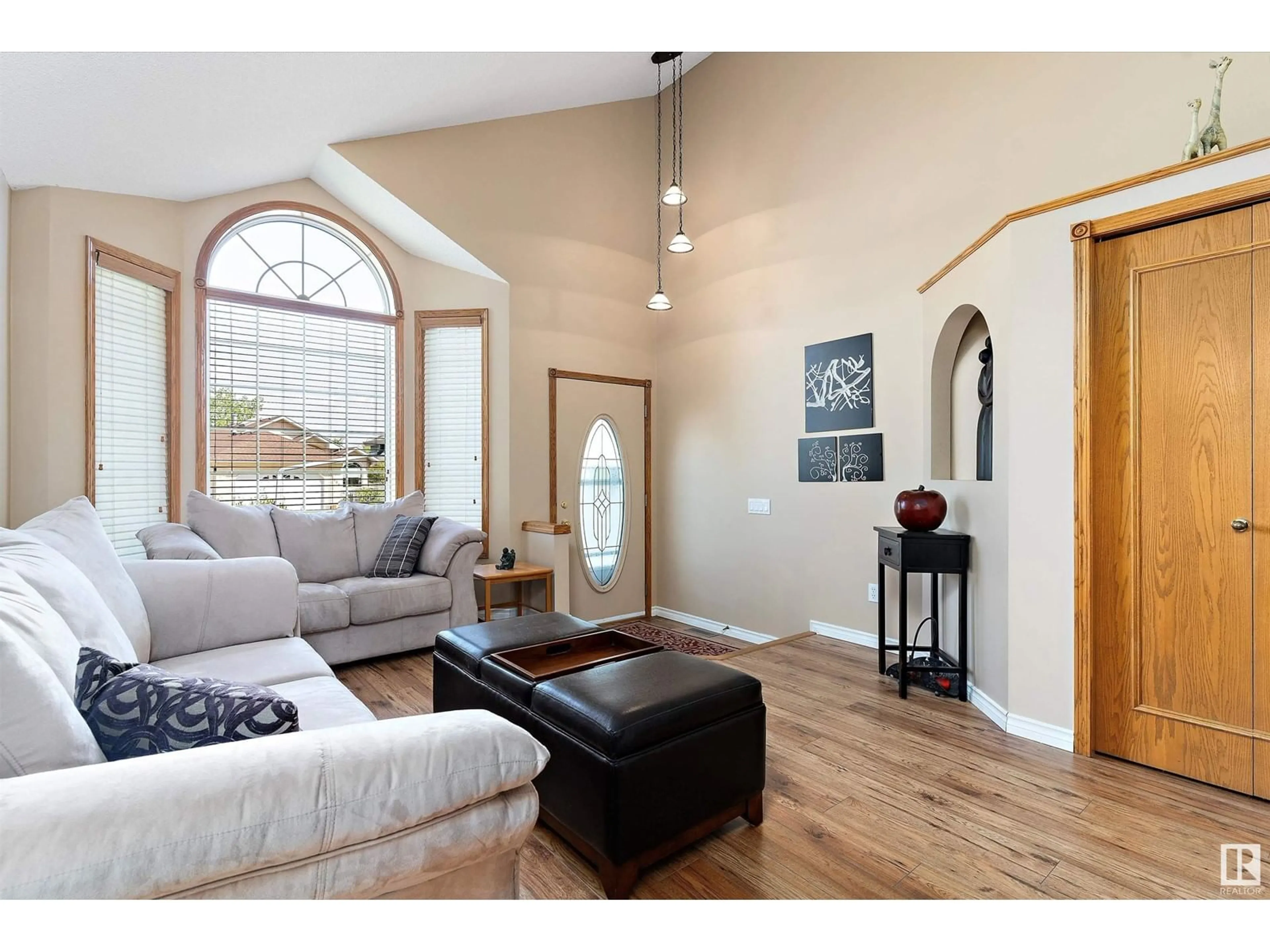 Living room with furniture, wood/laminate floor for 409 MEADOWVIEW TC, Sherwood Park Alberta T8H1X7