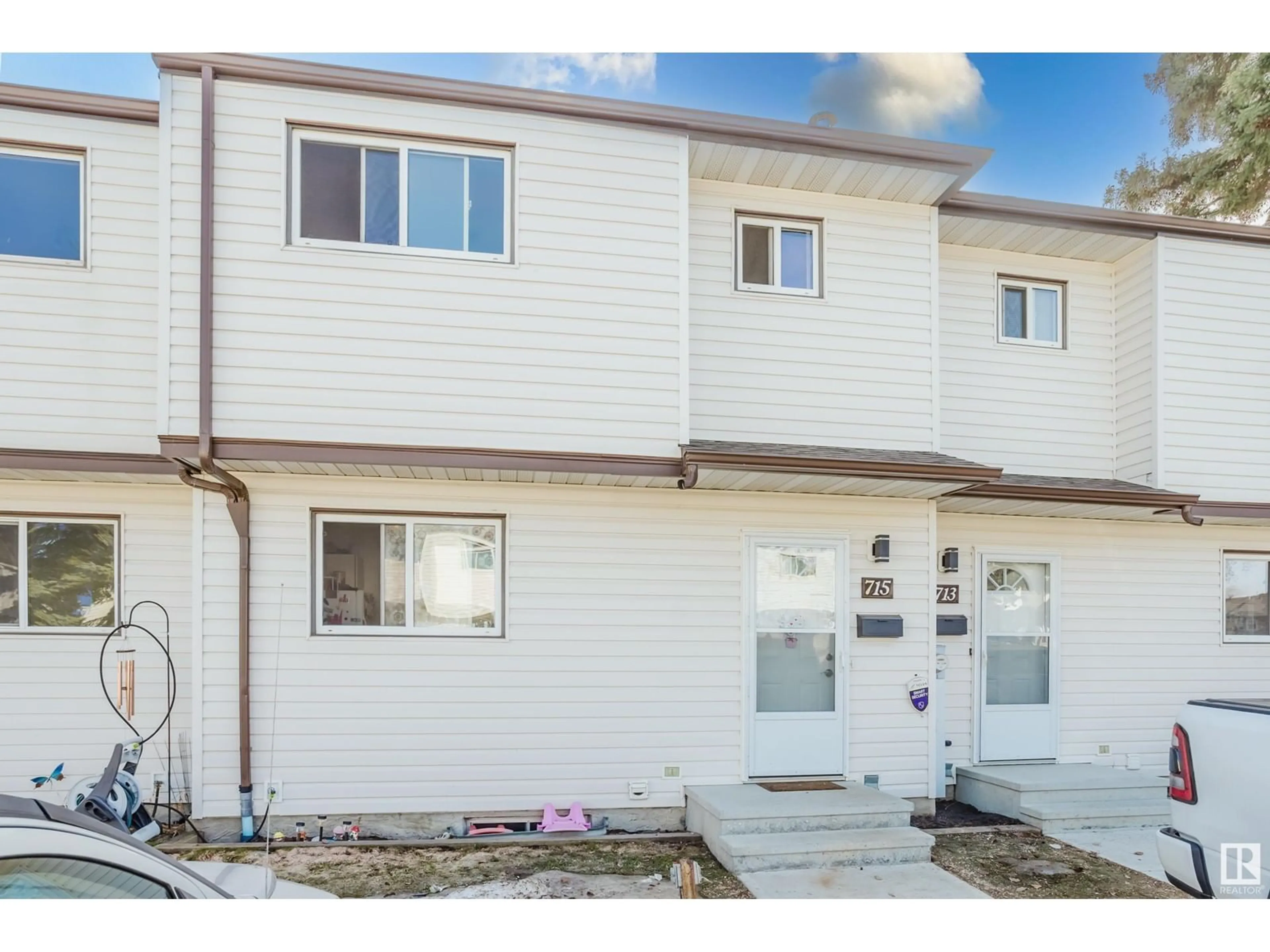 Home with vinyl exterior material, street for 715 CLAREVIEW RD, Edmonton Alberta T5A3S6