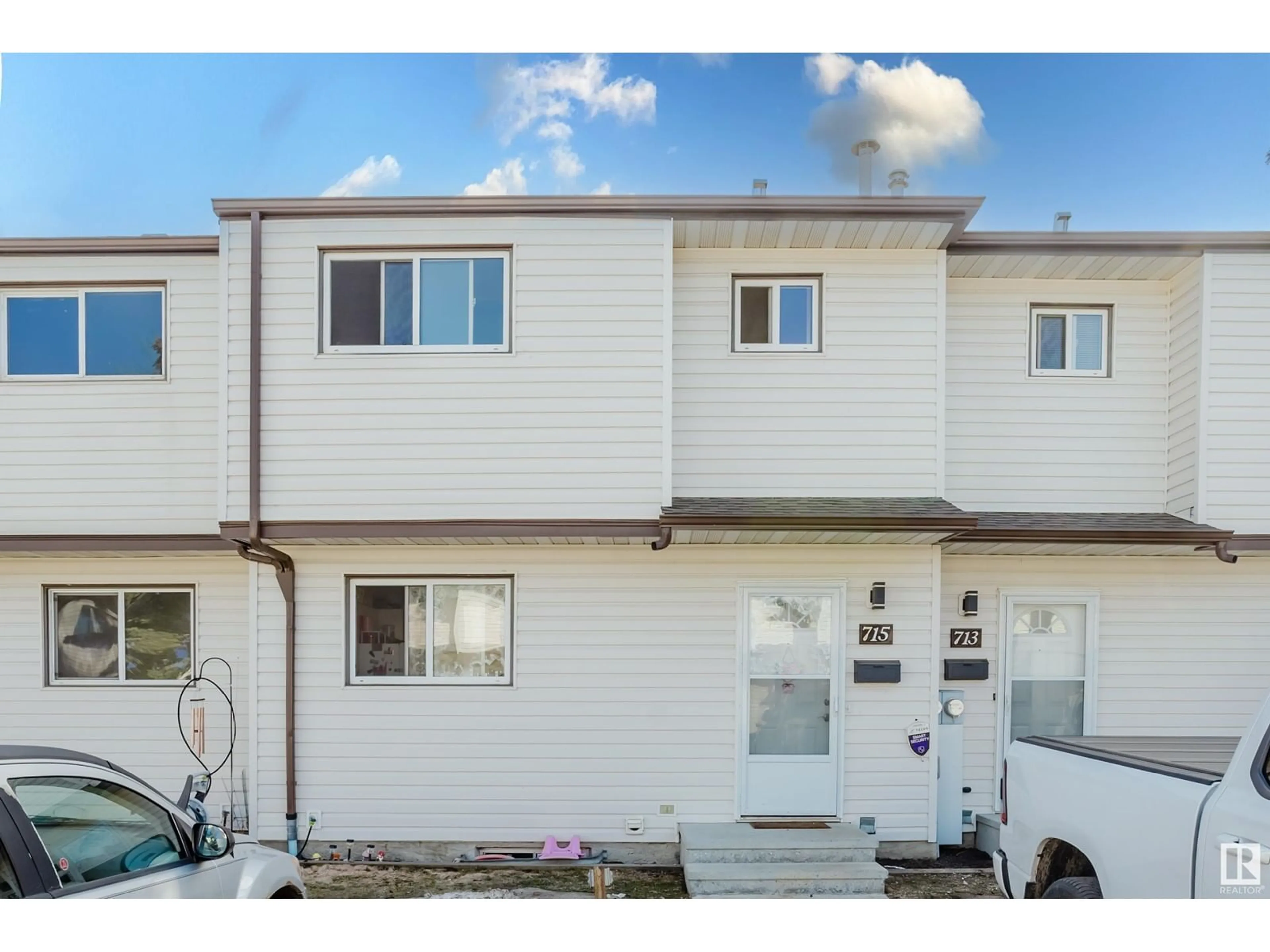 Home with vinyl exterior material, street for 715 CLAREVIEW RD, Edmonton Alberta T5A3S6