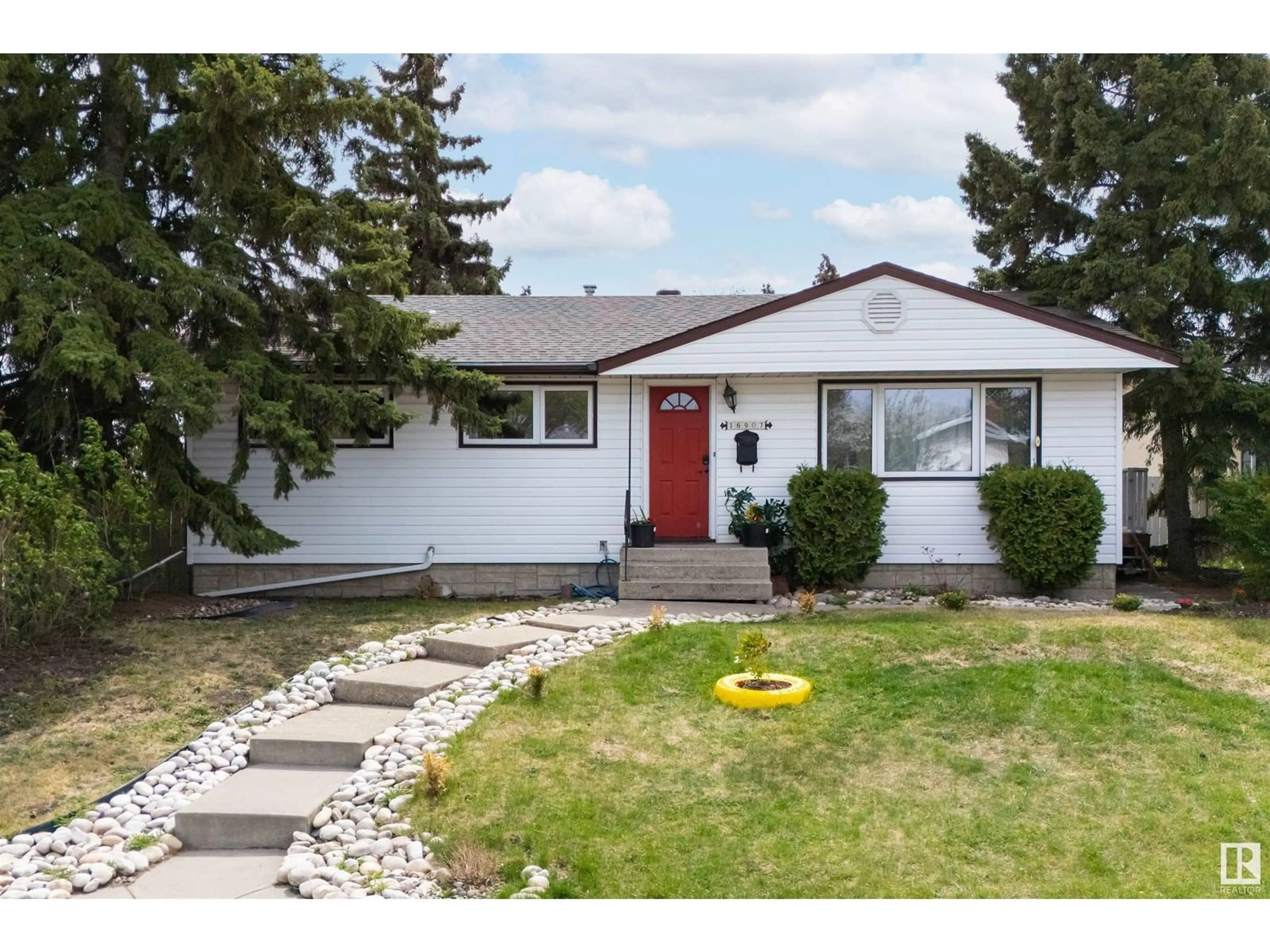 Home with vinyl exterior material, street for 16907 81 AV, Edmonton Alberta T5R3R1