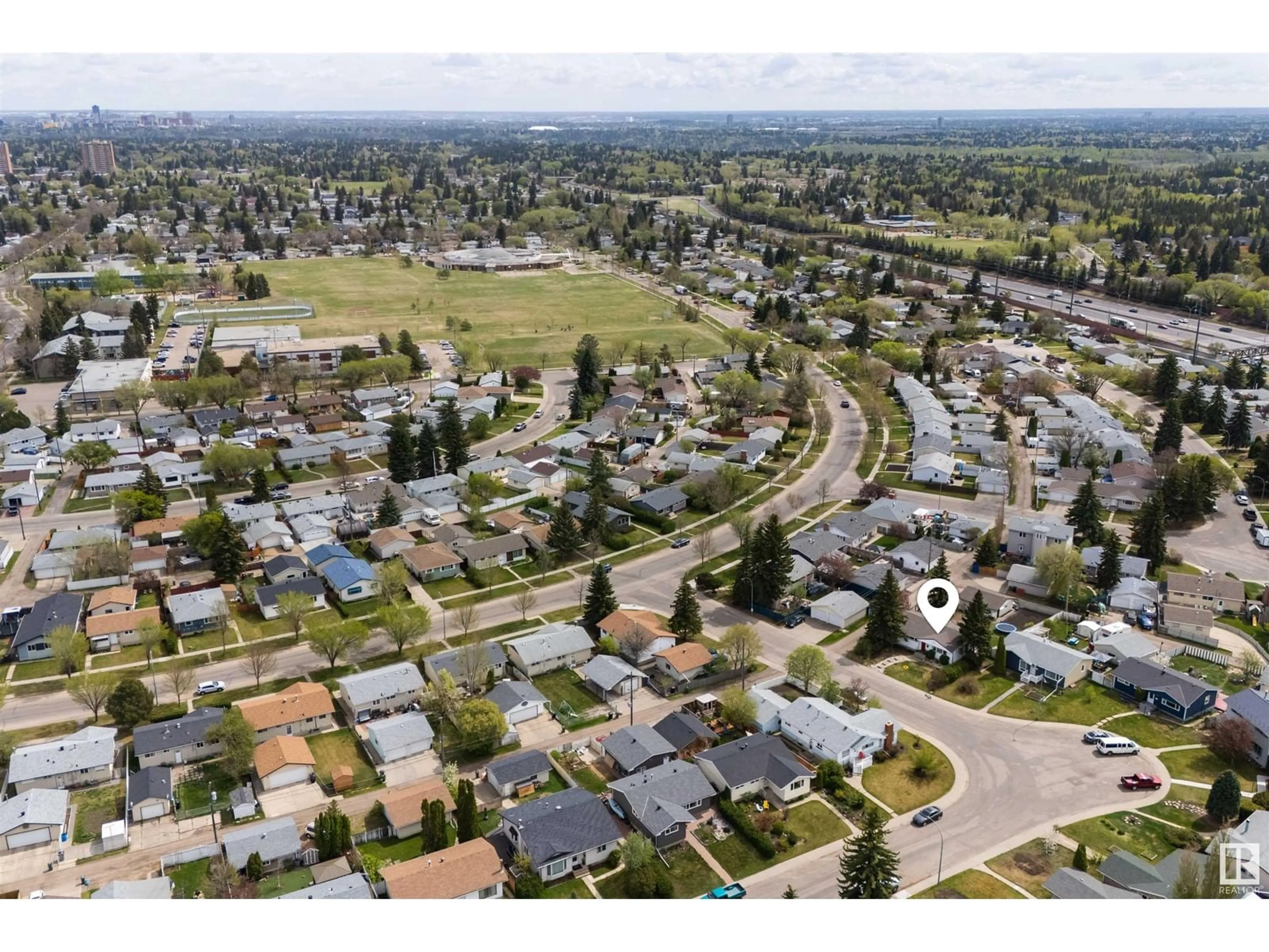 A pic from outside/outdoor area/front of a property/back of a property/a pic from drone, street for 16907 81 AV, Edmonton Alberta T5R3R1