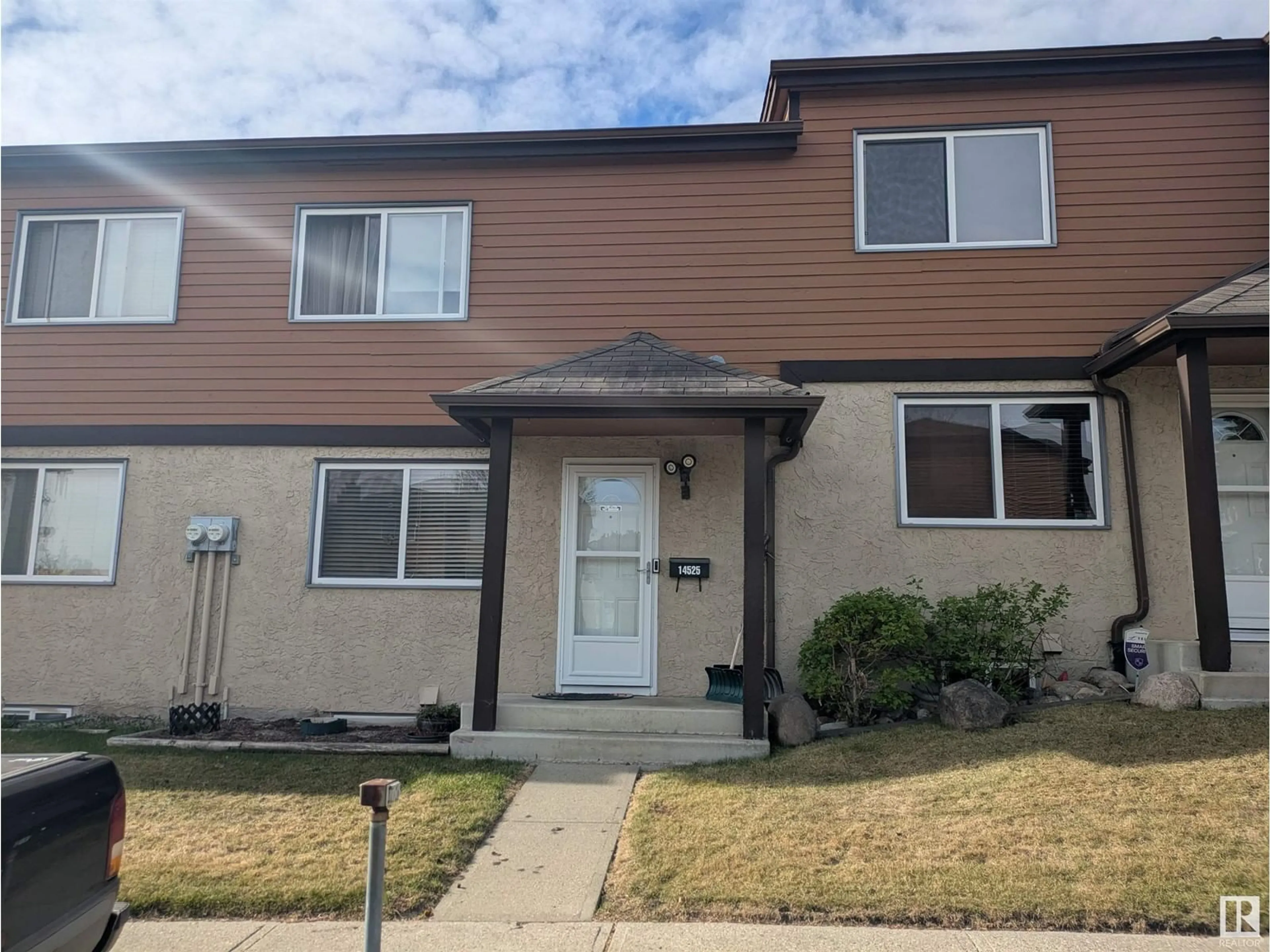 Home with vinyl exterior material, street for NW - 14525 52 ST, Edmonton Alberta T5A4N1