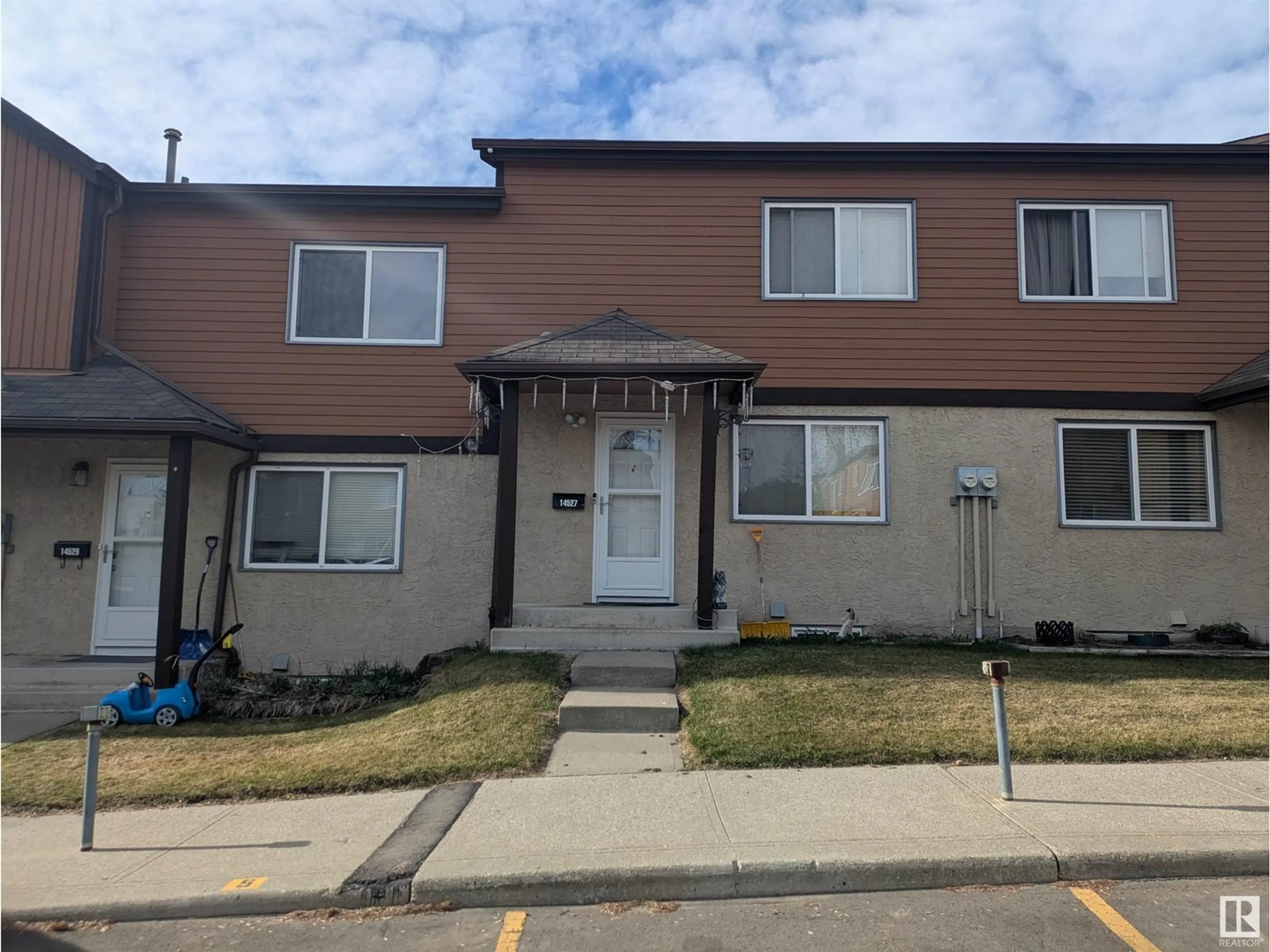 Home with vinyl exterior material, street for 14527 52 ST, Edmonton Alberta T5A4N1