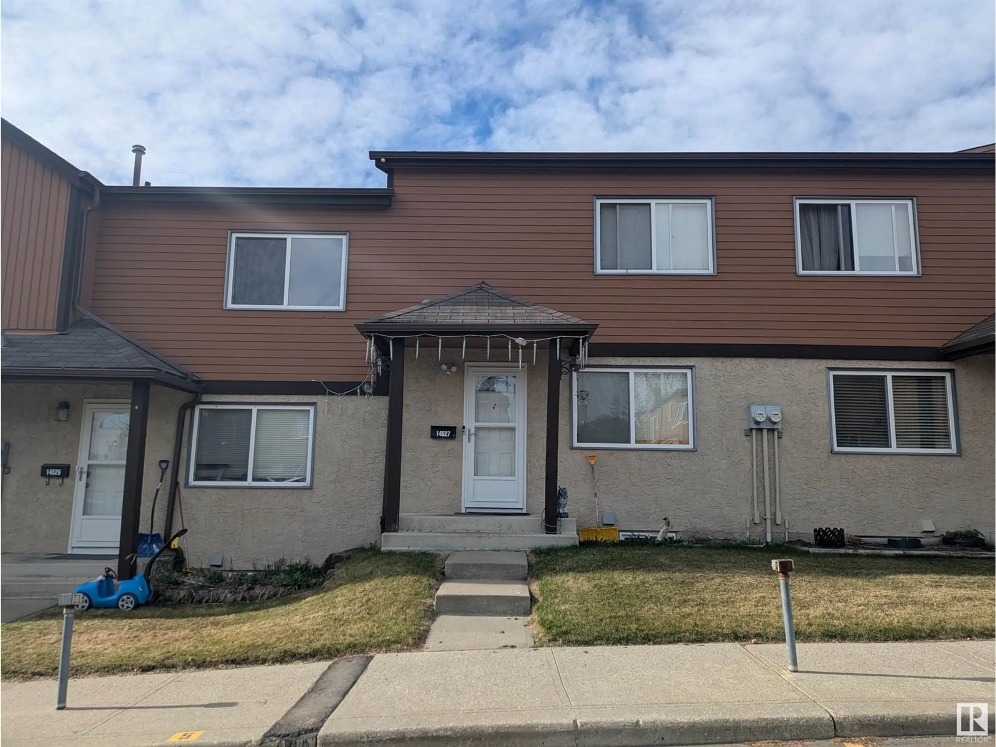 Home with vinyl exterior material, street for 14527 52 ST, Edmonton Alberta T5A4N1