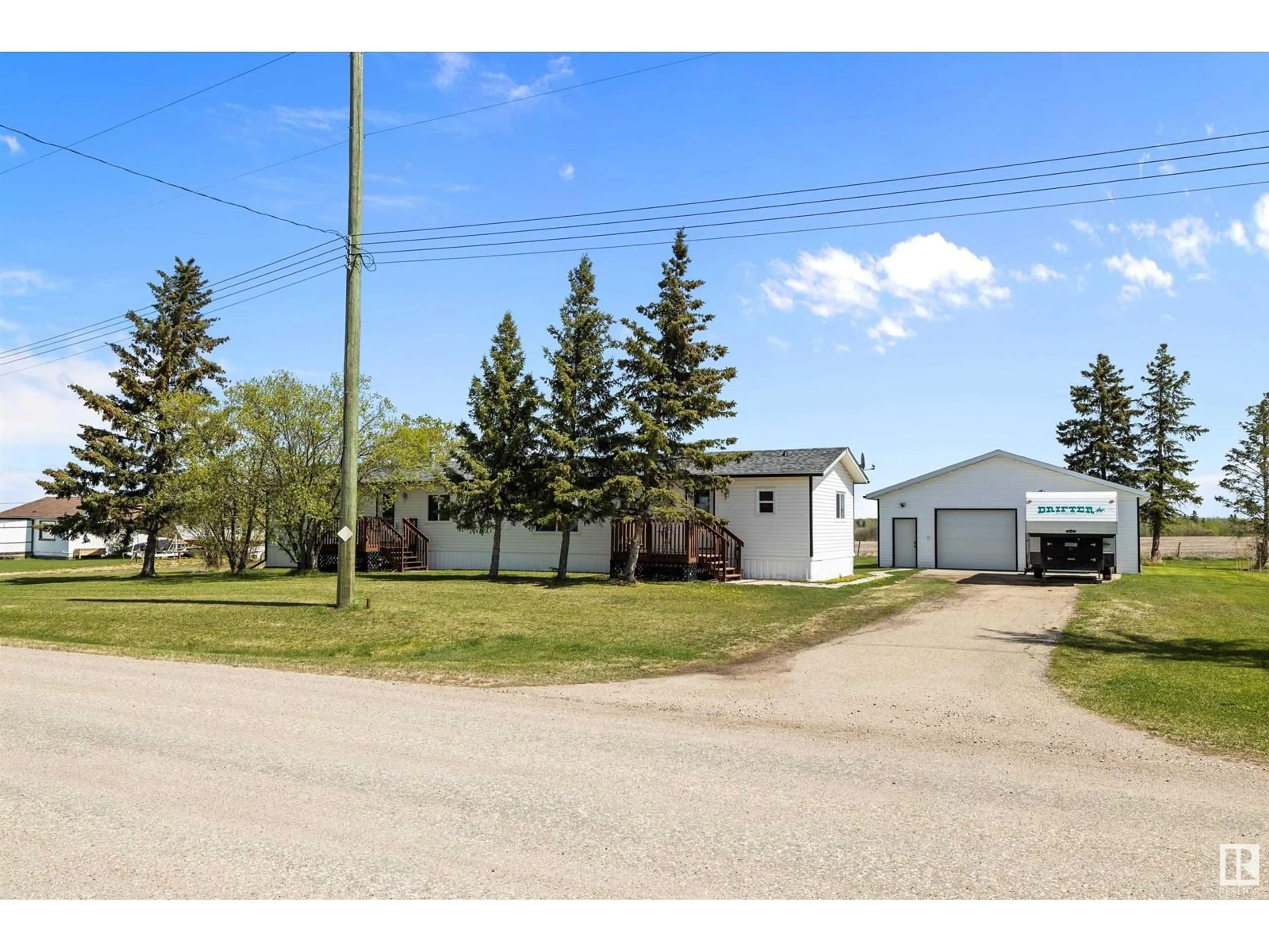 A pic from outside/outdoor area/front of a property/back of a property/a pic from drone, street for #21 - 56227 HWY 33, Rural Lac Ste. Anne County Alberta T0G1L0