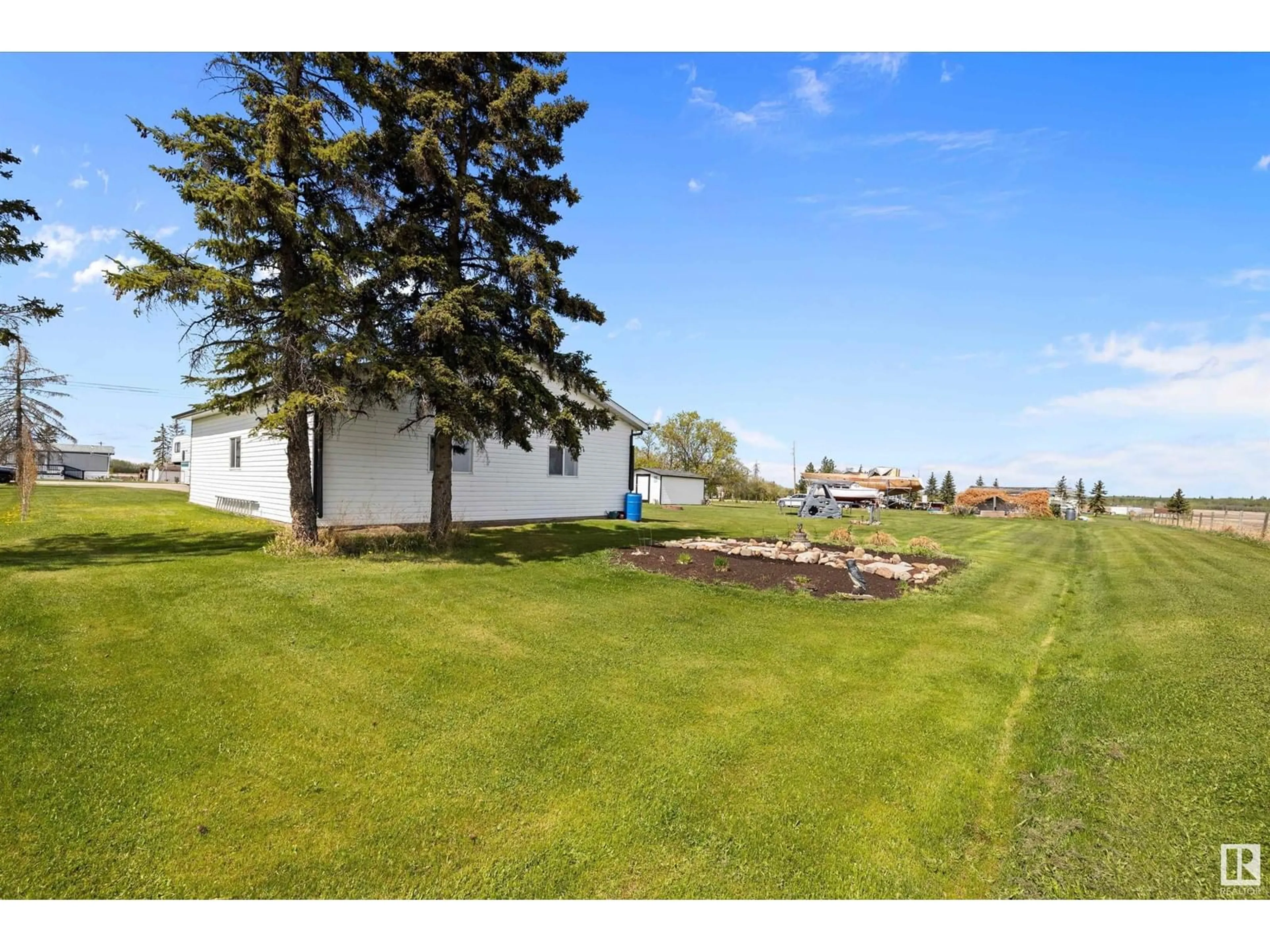 A pic from outside/outdoor area/front of a property/back of a property/a pic from drone, water/lake/river/ocean view for #21 - 56227 HWY 33, Rural Lac Ste. Anne County Alberta T0G1L0
