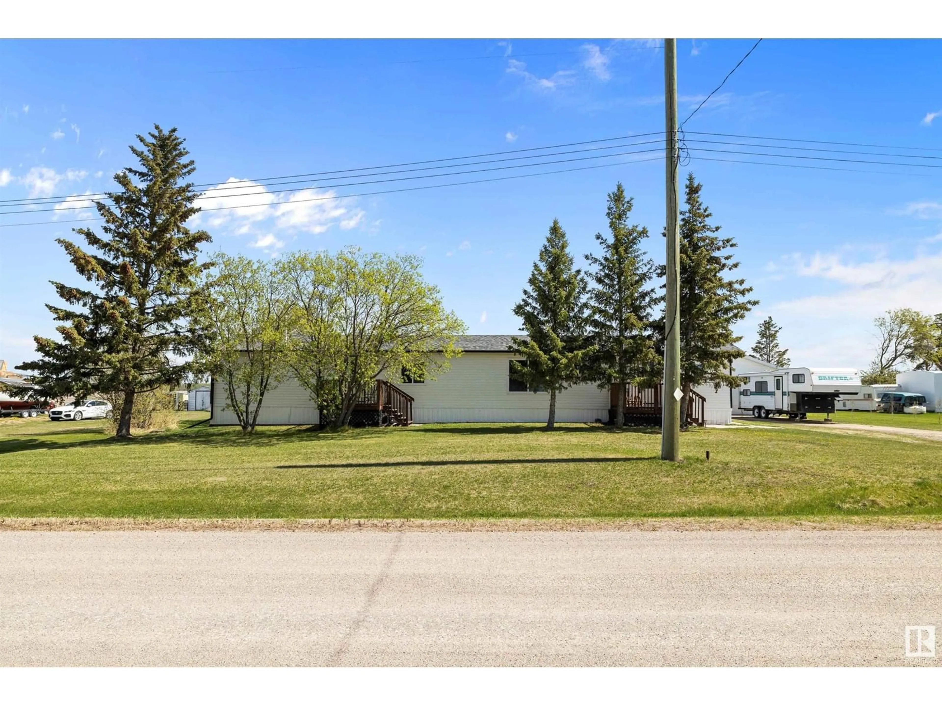 A pic from outside/outdoor area/front of a property/back of a property/a pic from drone, street for #21 - 56227 HWY 33, Rural Lac Ste. Anne County Alberta T0G1L0
