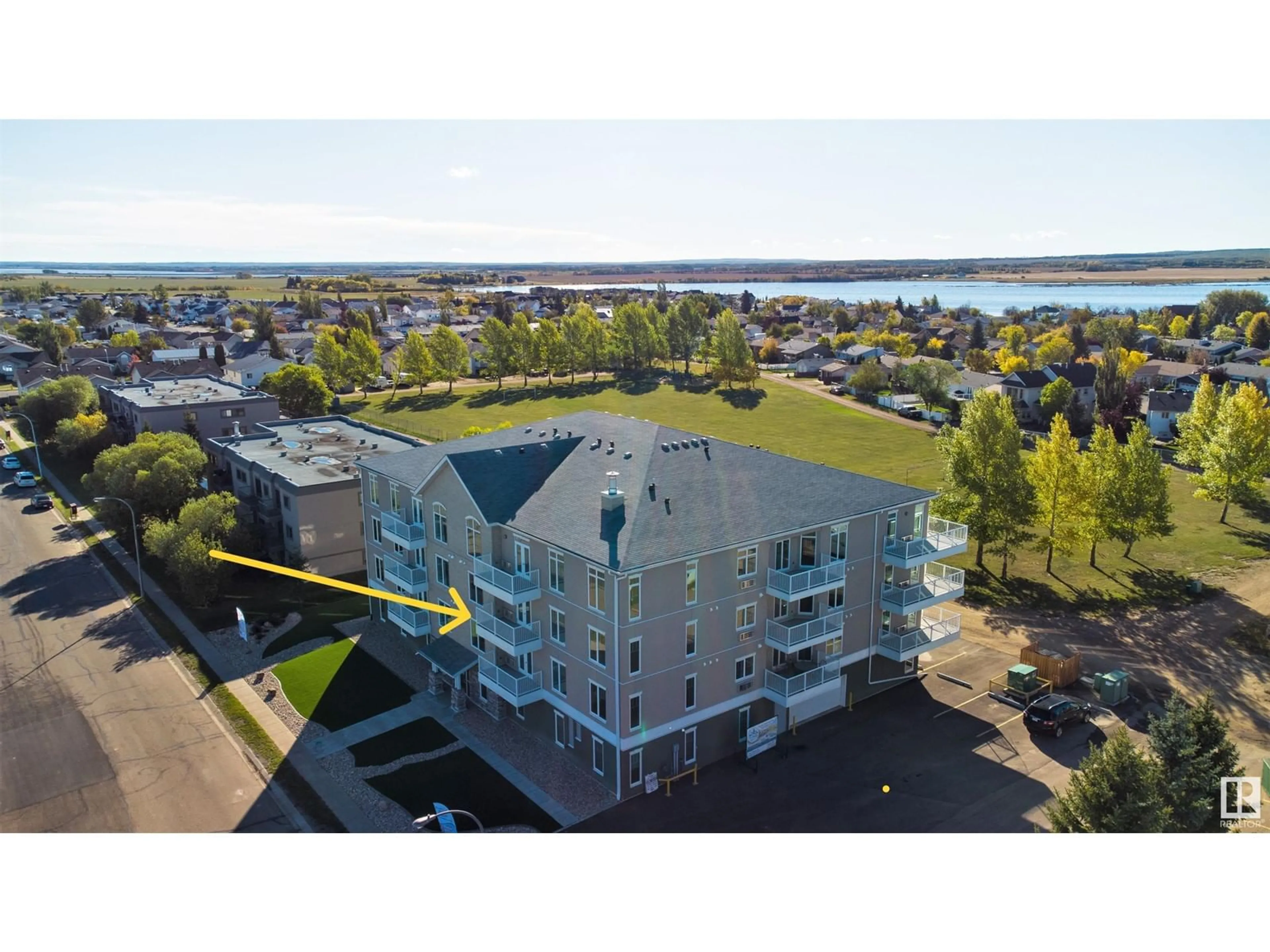 A pic from outside/outdoor area/front of a property/back of a property/a pic from drone, water/lake/river/ocean view for 203 - 4110 43 AV, Bonnyville Town Alberta T9N1S8