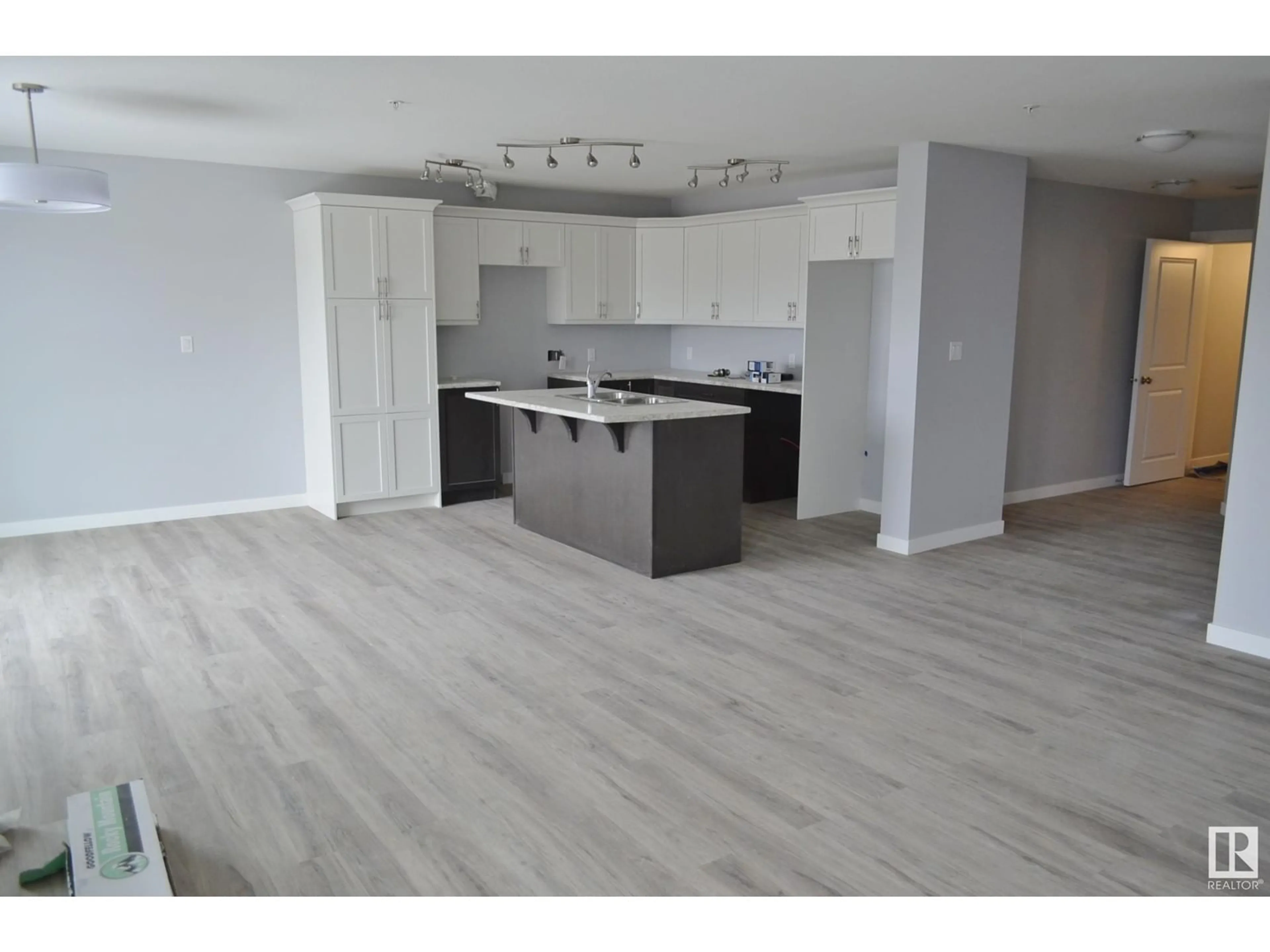 Open concept kitchen, wood/laminate floor for 203 - 4110 43 AV, Bonnyville Town Alberta T9N1S8