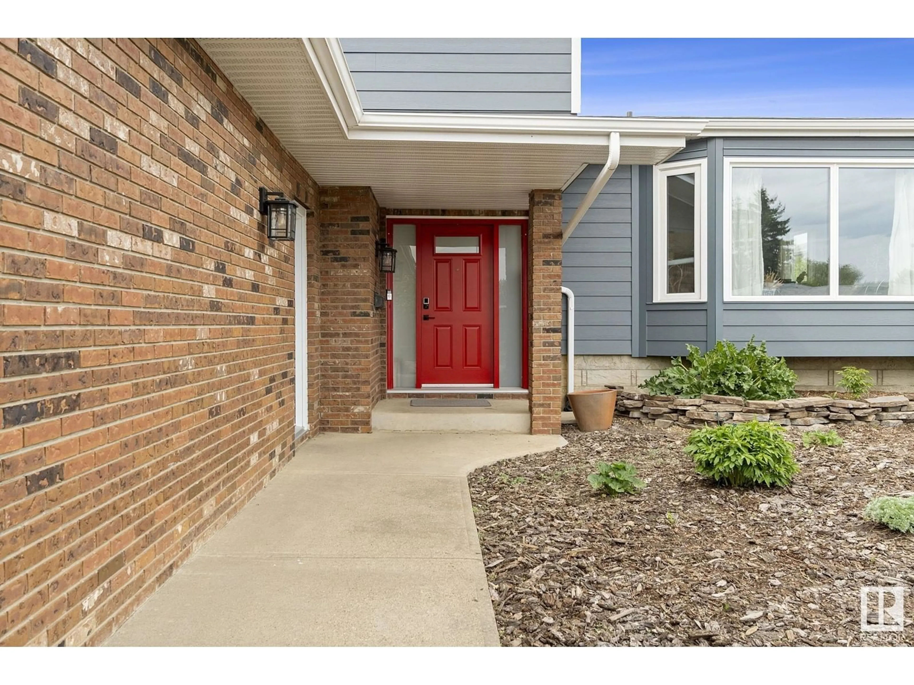 Home with brick exterior material, street for NW - 10922 41 AV, Edmonton Alberta T6J2P4