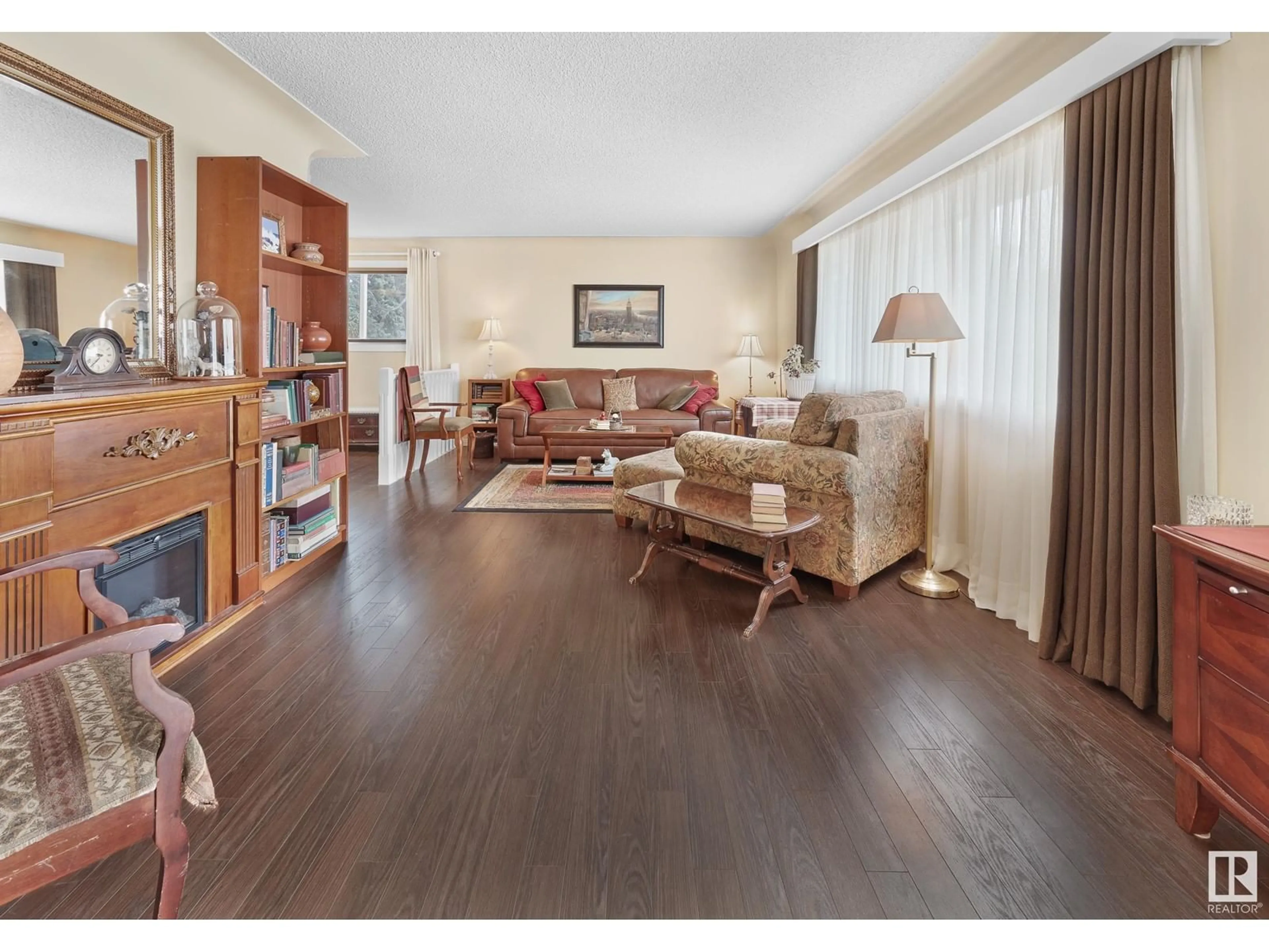 Living room with furniture, wood/laminate floor for 14304 89A AV, Edmonton Alberta T5R4S7