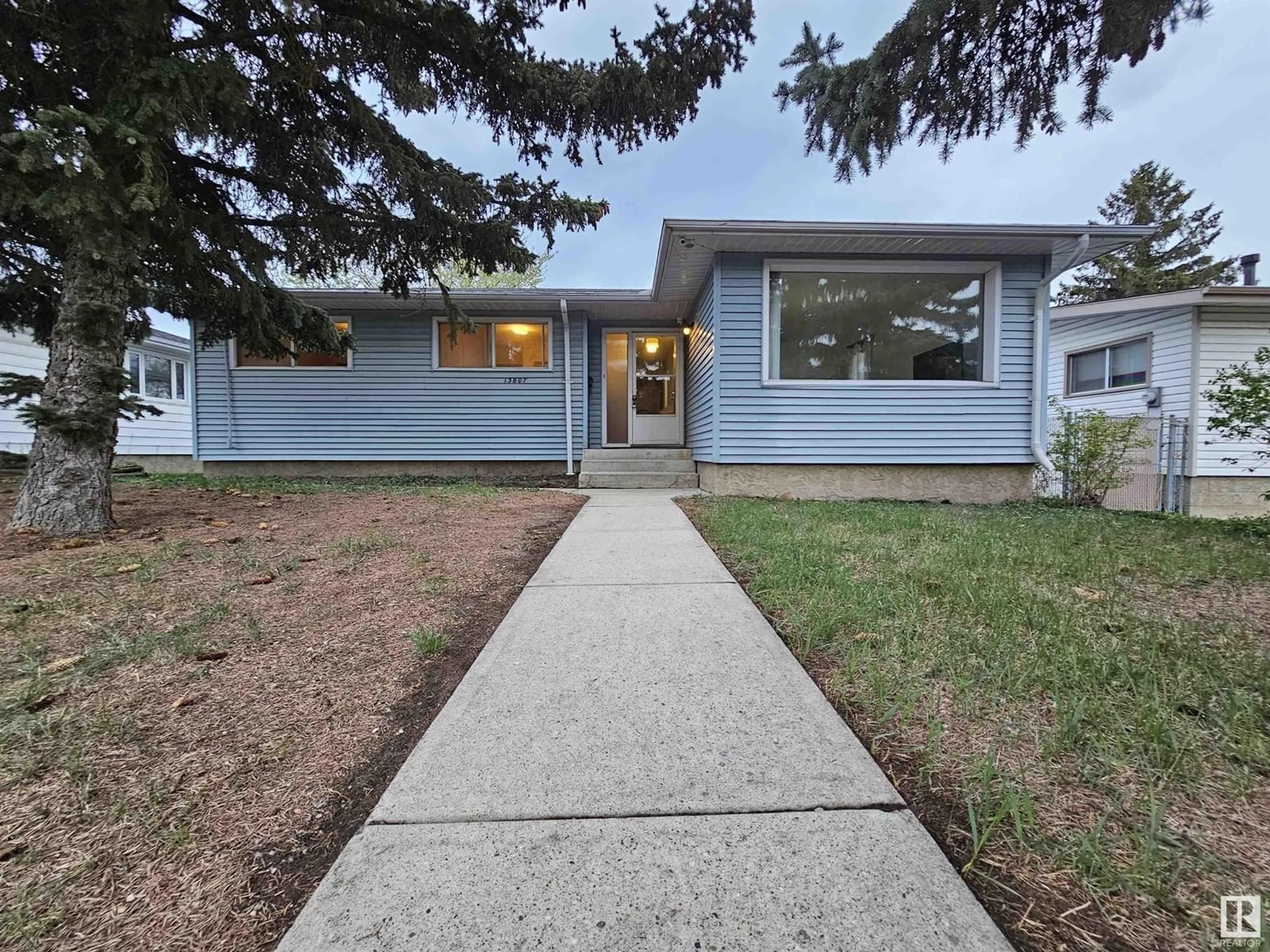 Home with vinyl exterior material, street for 13807 74 ST, Edmonton Alberta T5C0X8