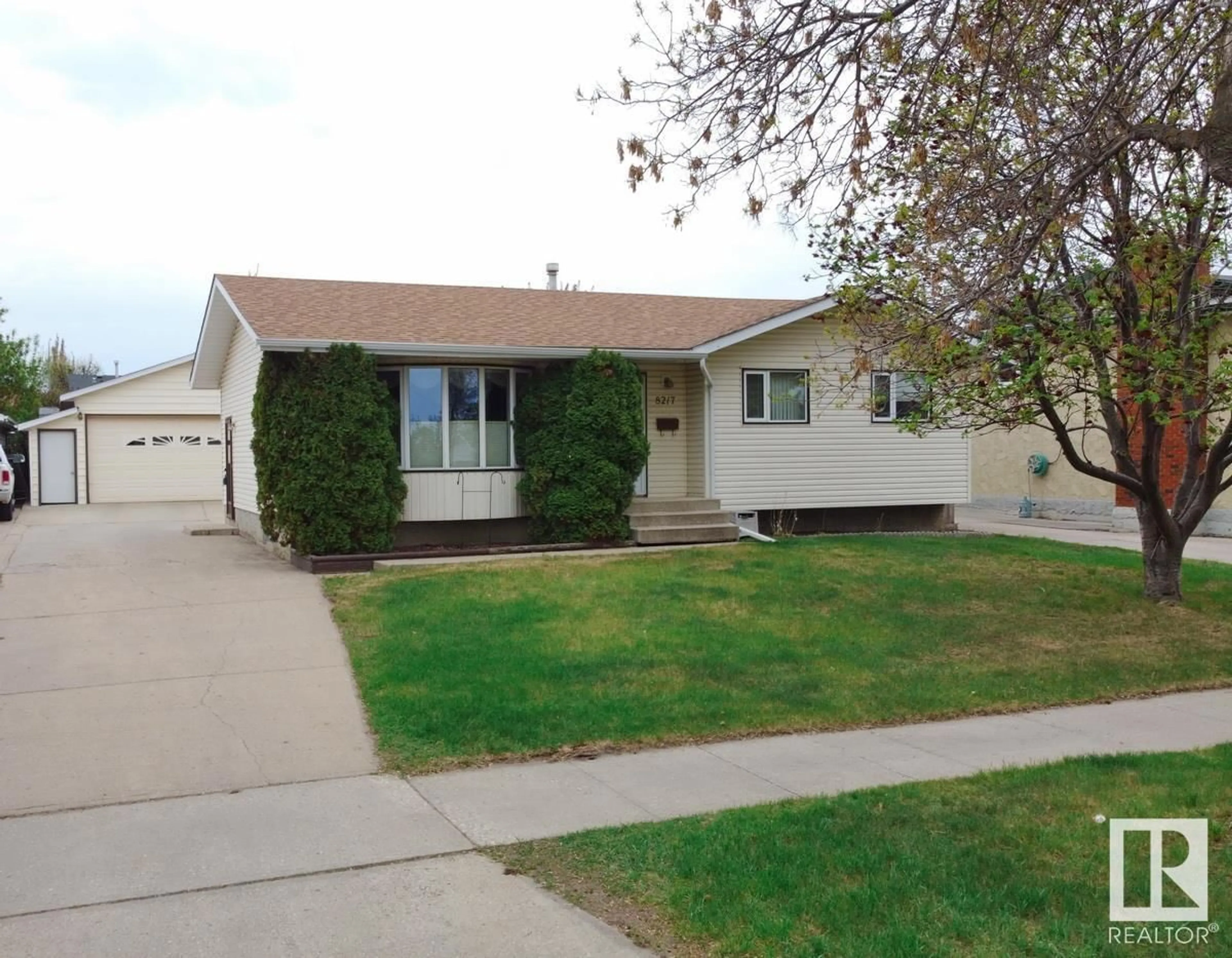Home with vinyl exterior material, street for 8217 99 AV, Fort Saskatchewan Alberta T8L3E4
