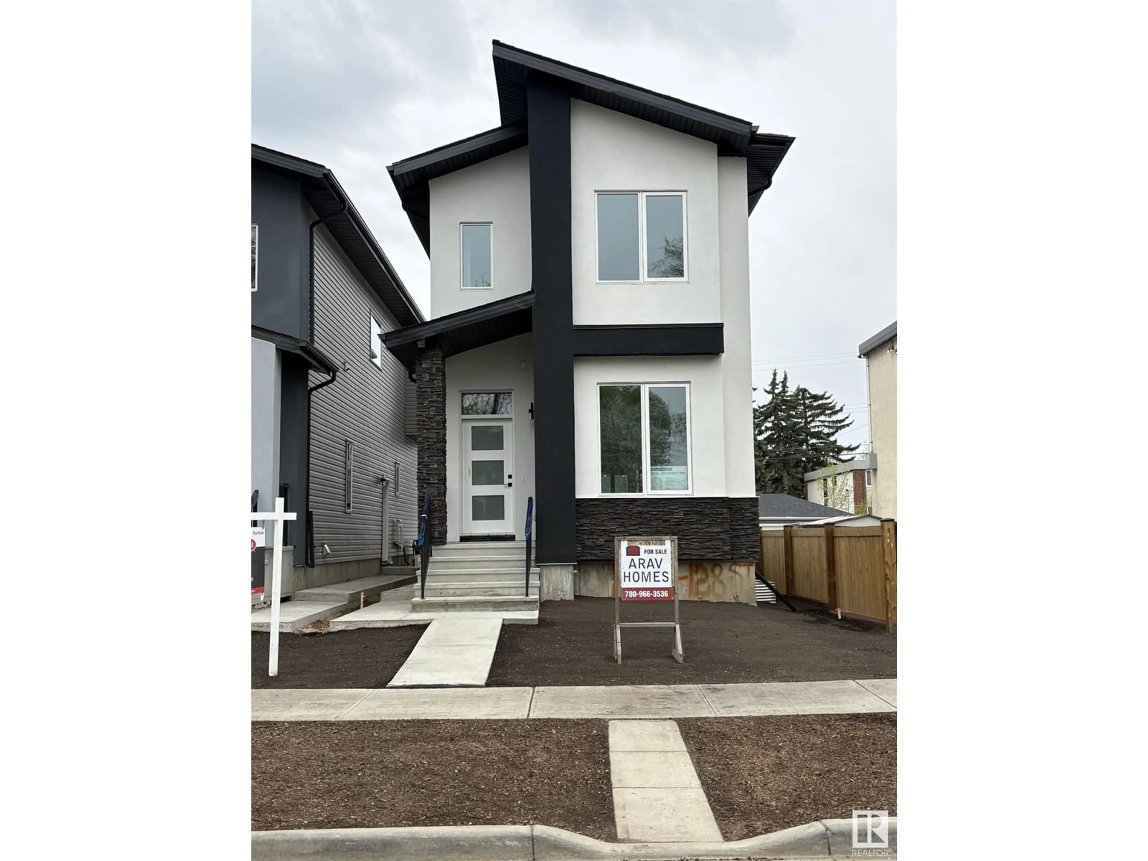 Home with vinyl exterior material, street for 11036 128 ST, Edmonton Alberta T5M0W6