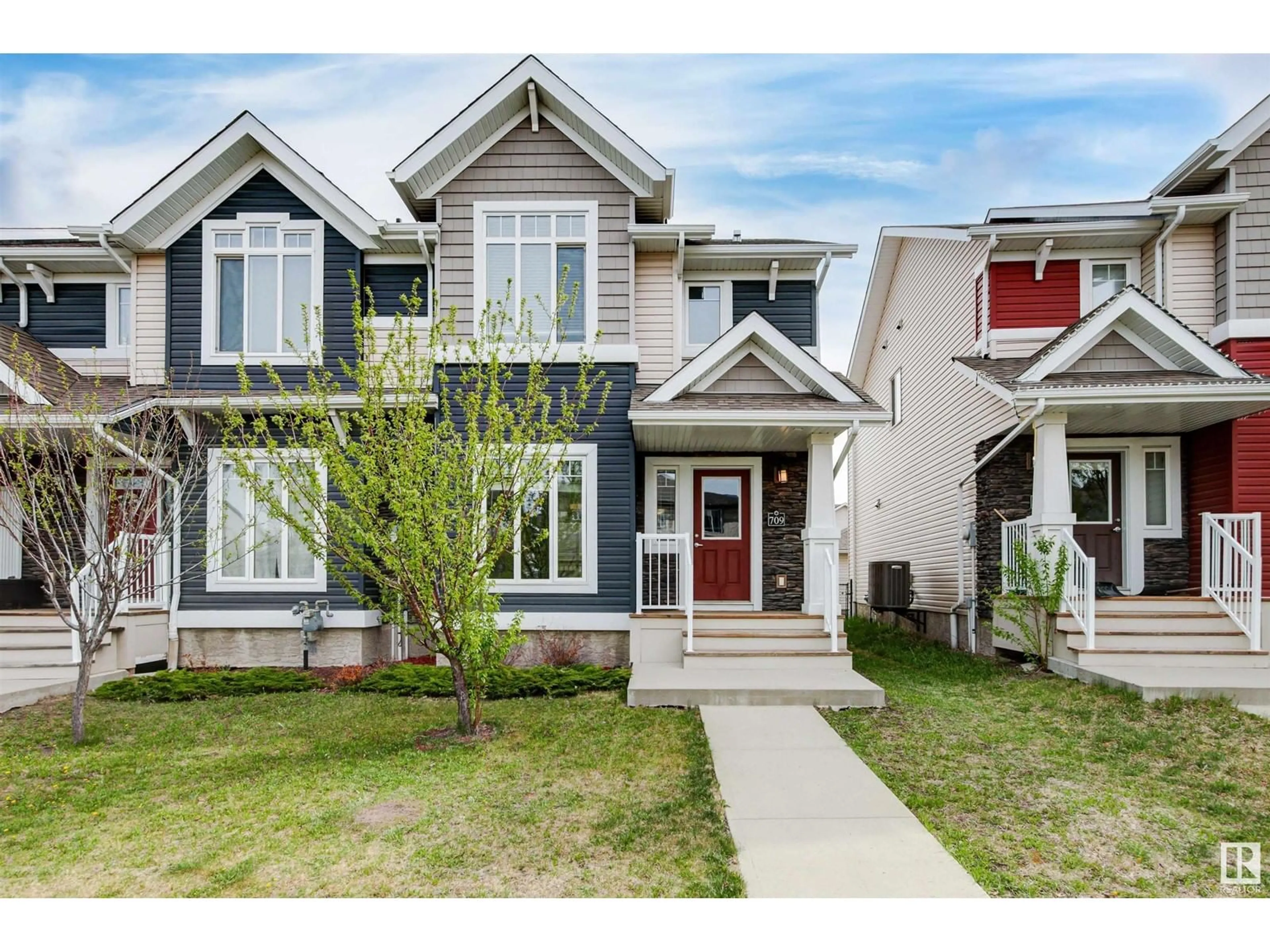 Home with vinyl exterior material, street for SW - 709 177 ST, Edmonton Alberta T6W2L7