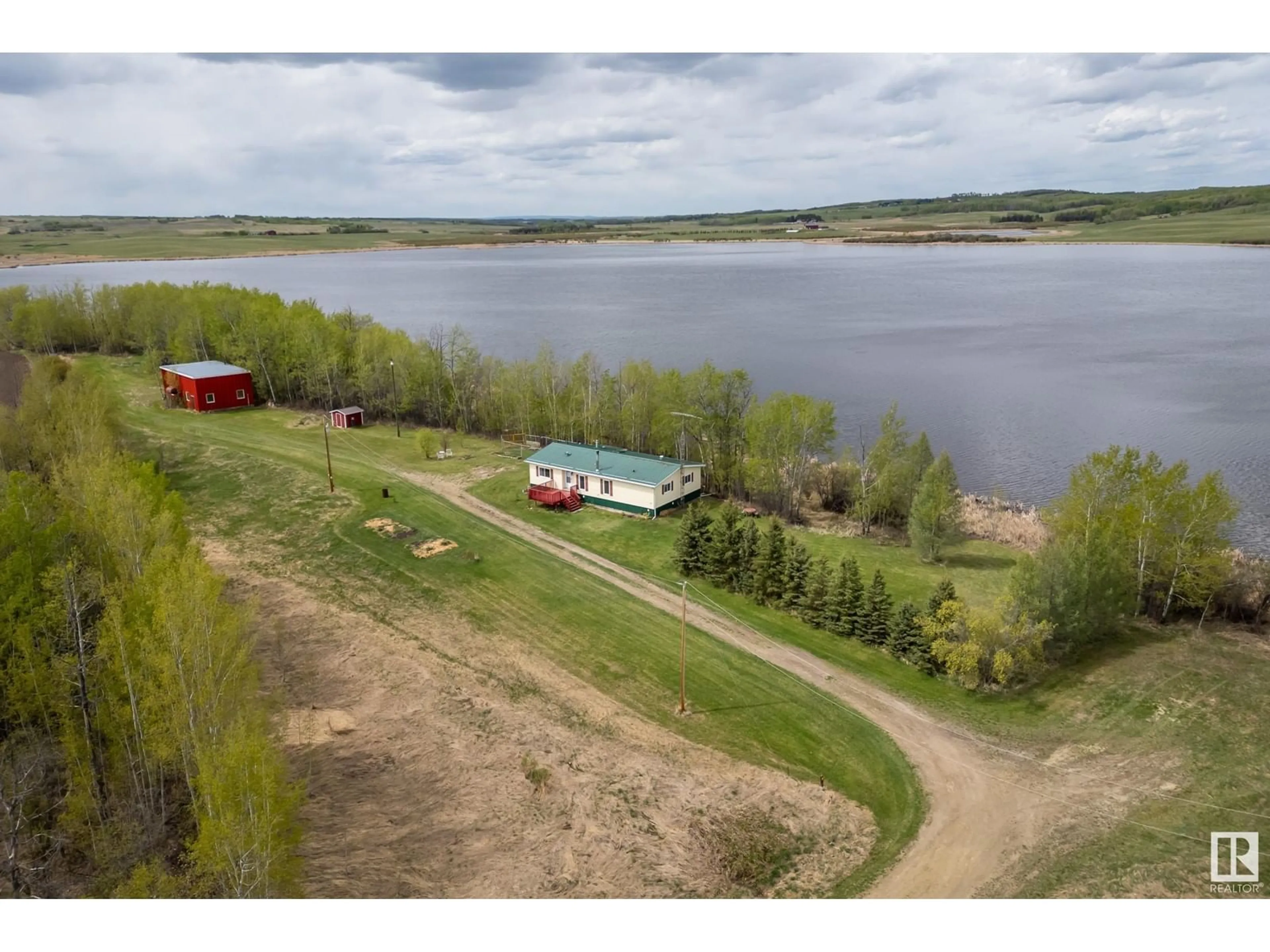 A pic from outside/outdoor area/front of a property/back of a property/a pic from drone, water/lake/river/ocean view for 55418 RGE ROAD 70, Rural Lac Ste. Anne County Alberta T0E2A0