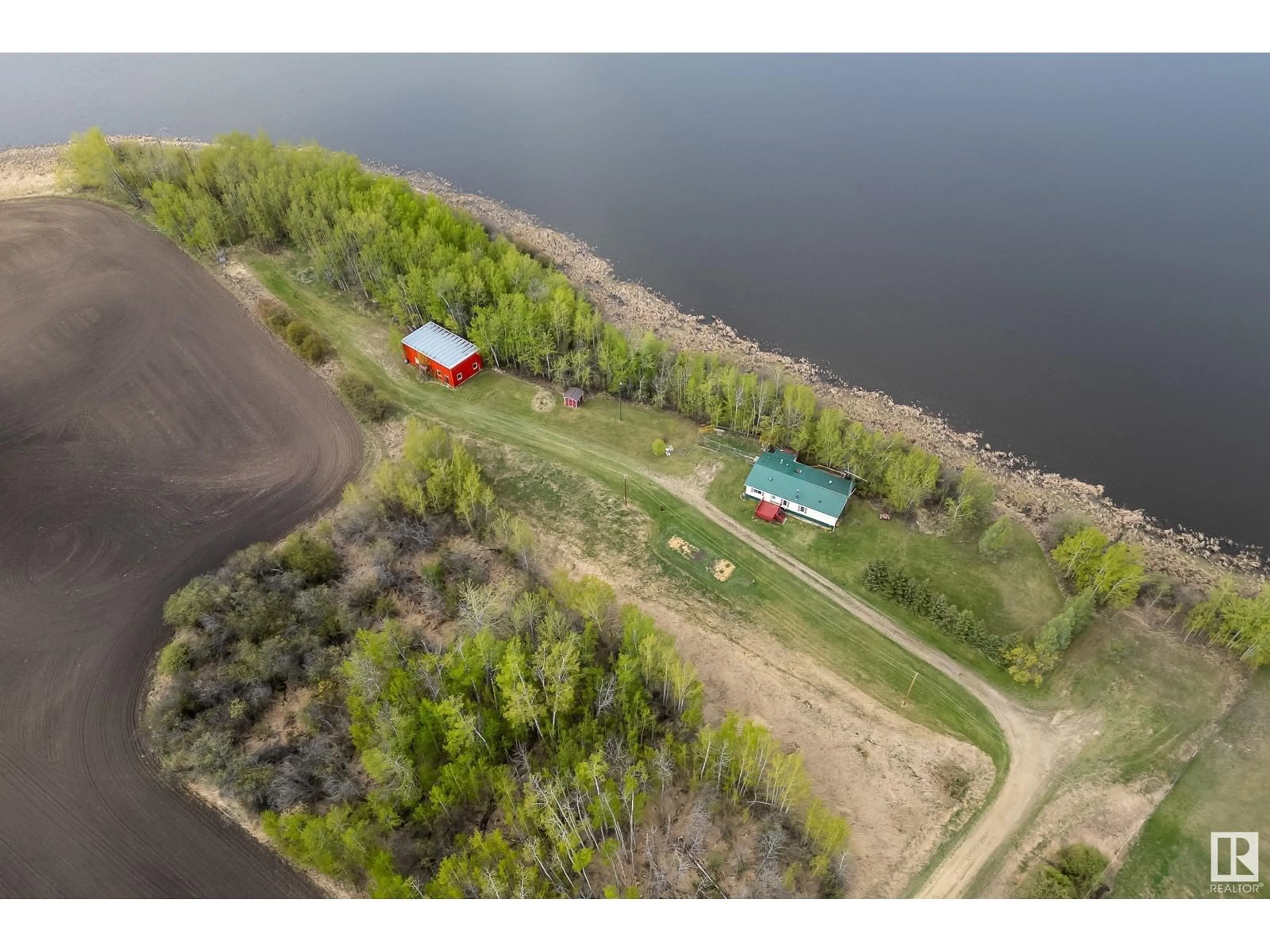 A pic from outside/outdoor area/front of a property/back of a property/a pic from drone, water/lake/river/ocean view for 55418 RGE ROAD 70, Rural Lac Ste. Anne County Alberta T0E2A0