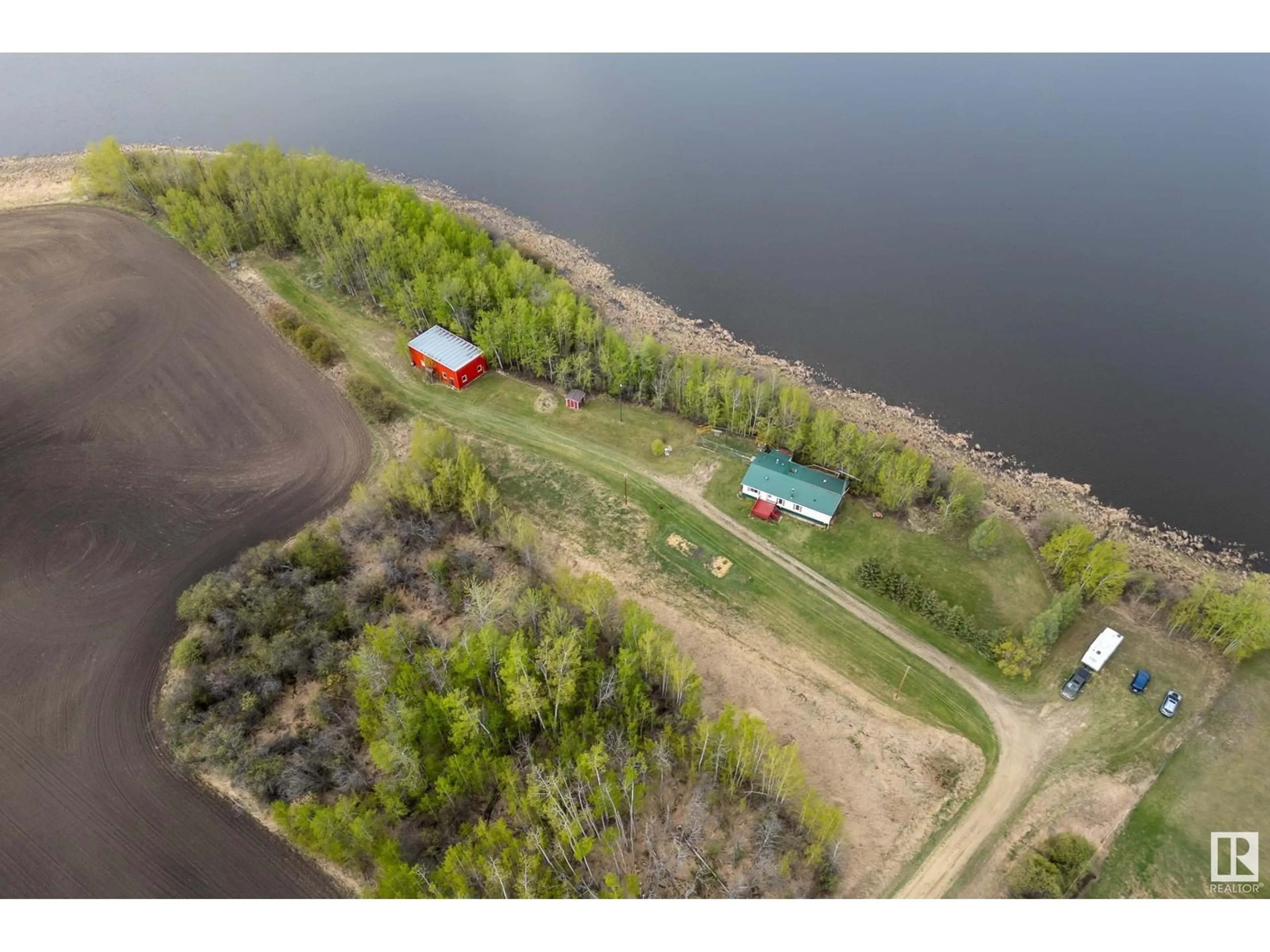 A pic from outside/outdoor area/front of a property/back of a property/a pic from drone, water/lake/river/ocean view for 55418 RGE ROAD 70, Rural Lac Ste. Anne County Alberta T0E2A0