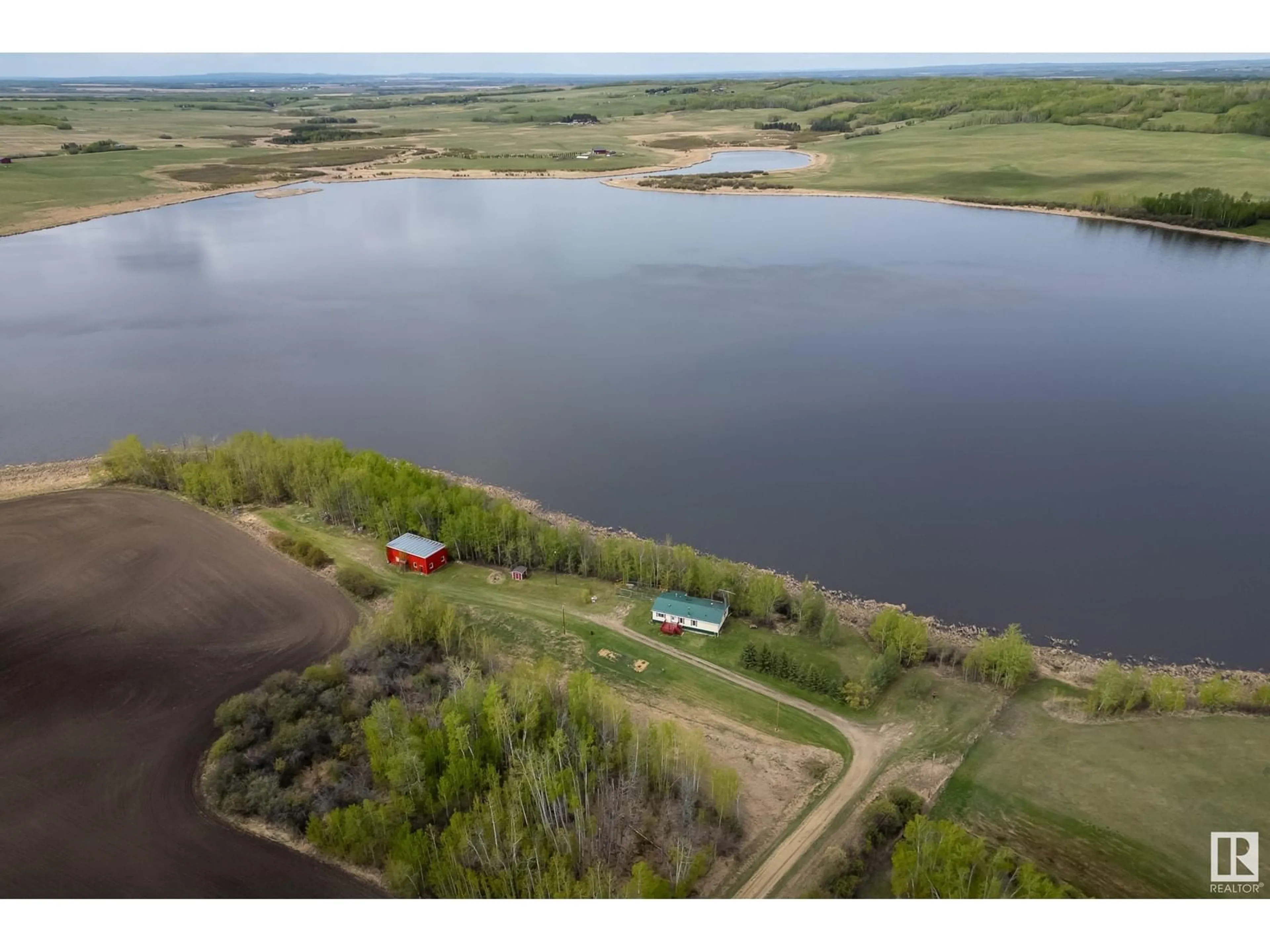 A pic from outside/outdoor area/front of a property/back of a property/a pic from drone, water/lake/river/ocean view for 55418 RGE ROAD 70, Rural Lac Ste. Anne County Alberta T0E2A0